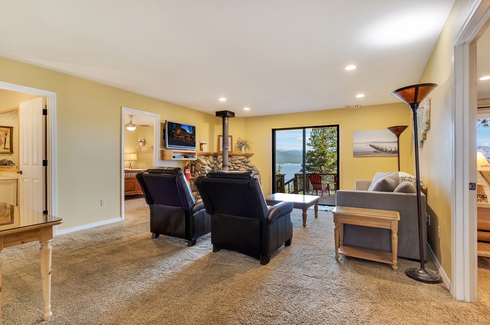 Lower living area with sofa sleeper, Smart TV, and deck