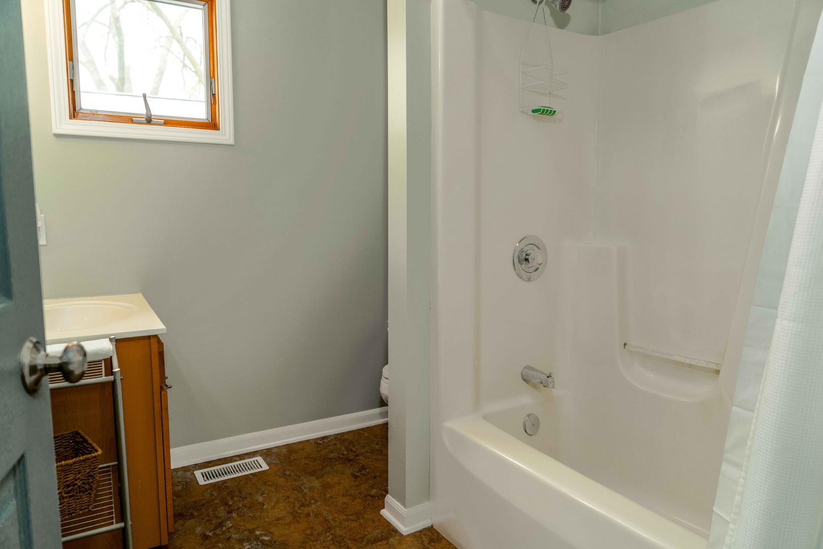 The 2nd-floor full bathroom includes a single vanity & shower/tub combo