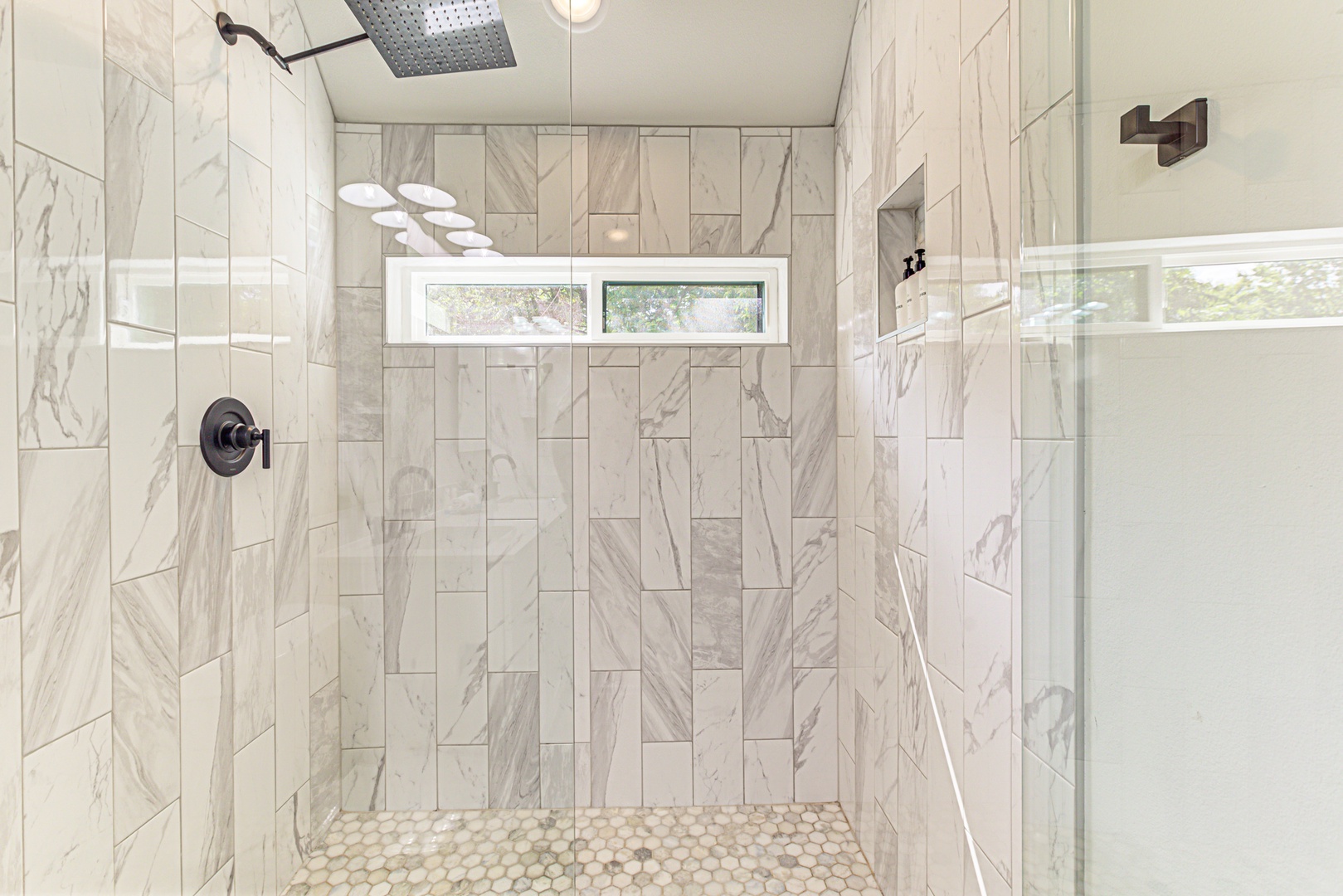 Ensuite bathroom with dual sinks and stand-up shower