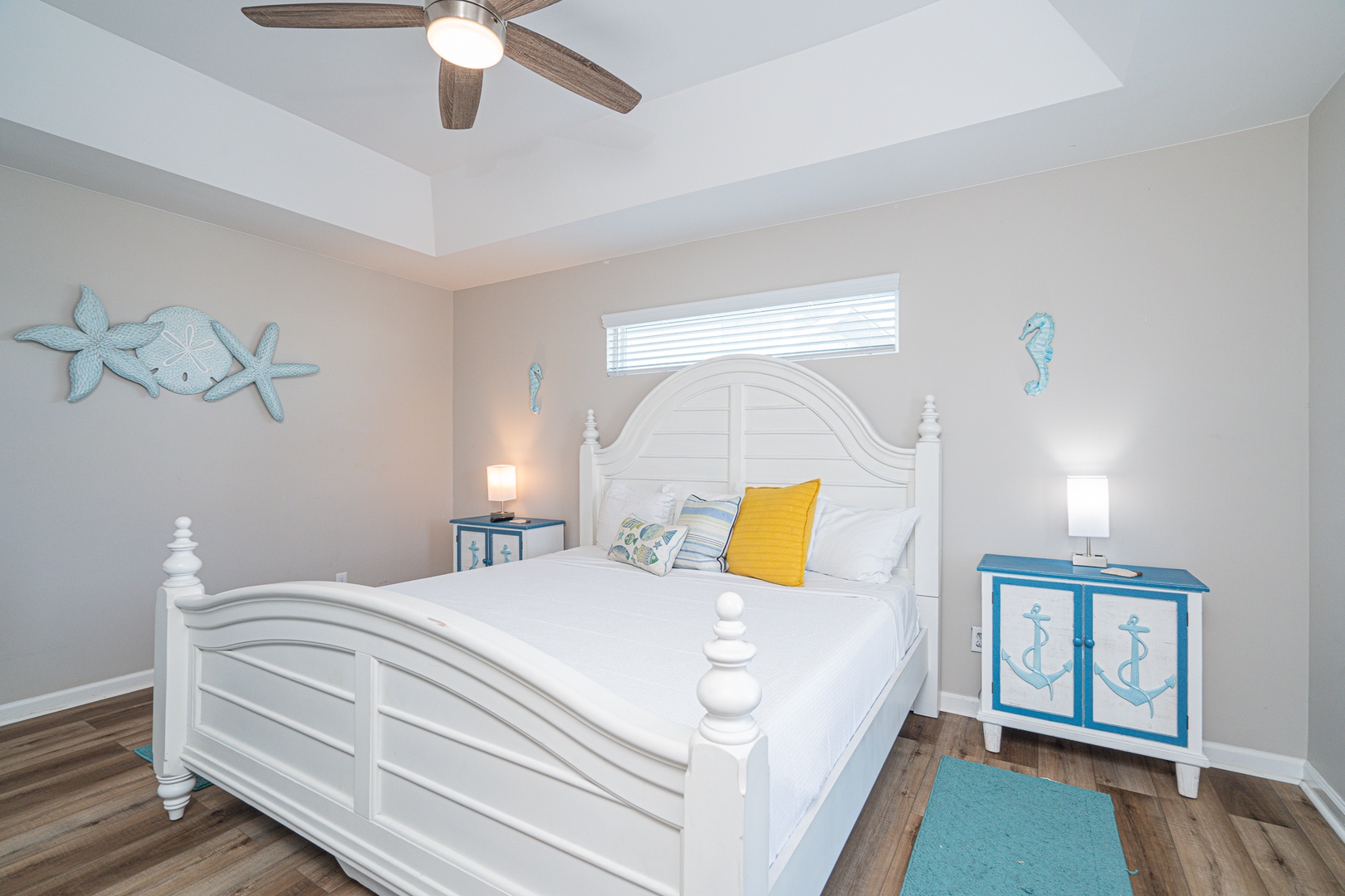 This 2nd floor king bedroom boasts a Smart TV, ceiling fan, & balcony access