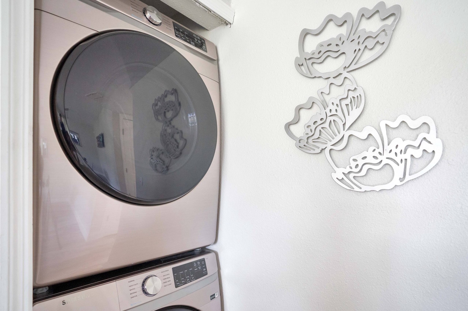 Private laundry is available for your stay, tucked away in kitchen