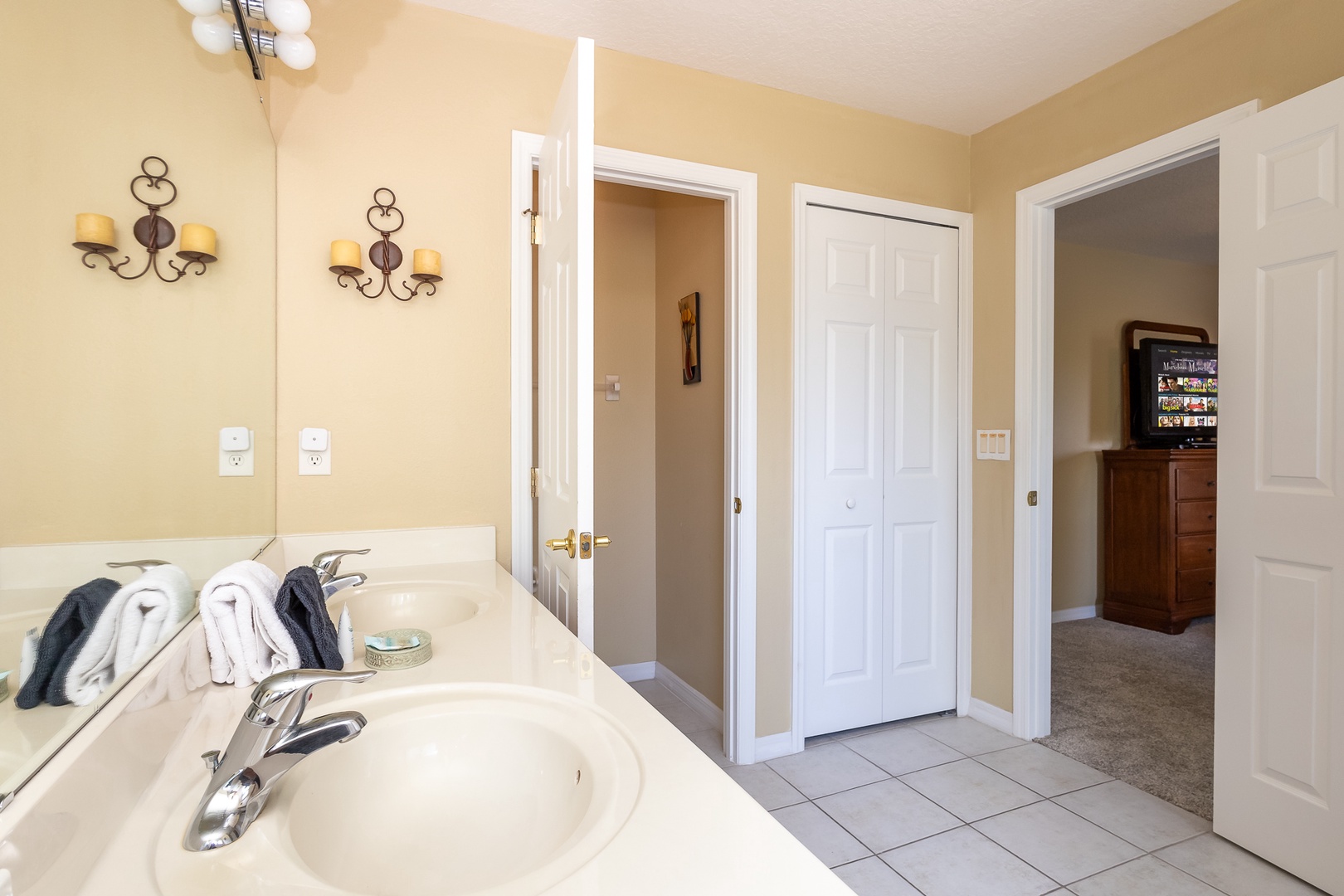 The king en suite offers a dual vanity, glass shower, & soaking tub