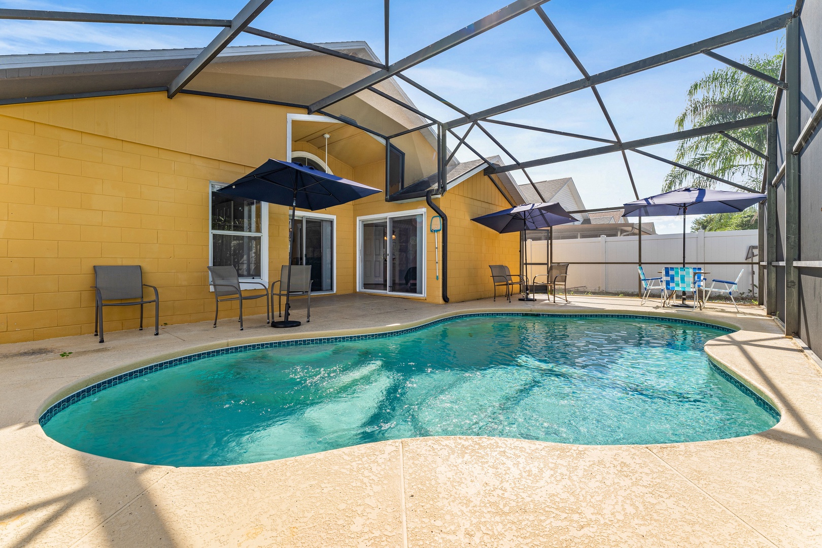 Screened in pool with outdoor seating