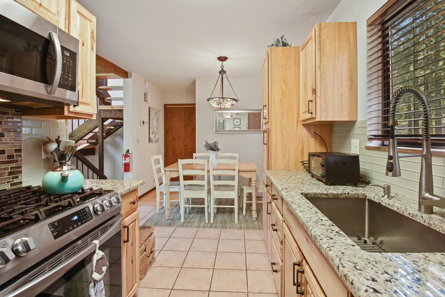 The updated kitchen boasts ample storage space & all the comforts of home