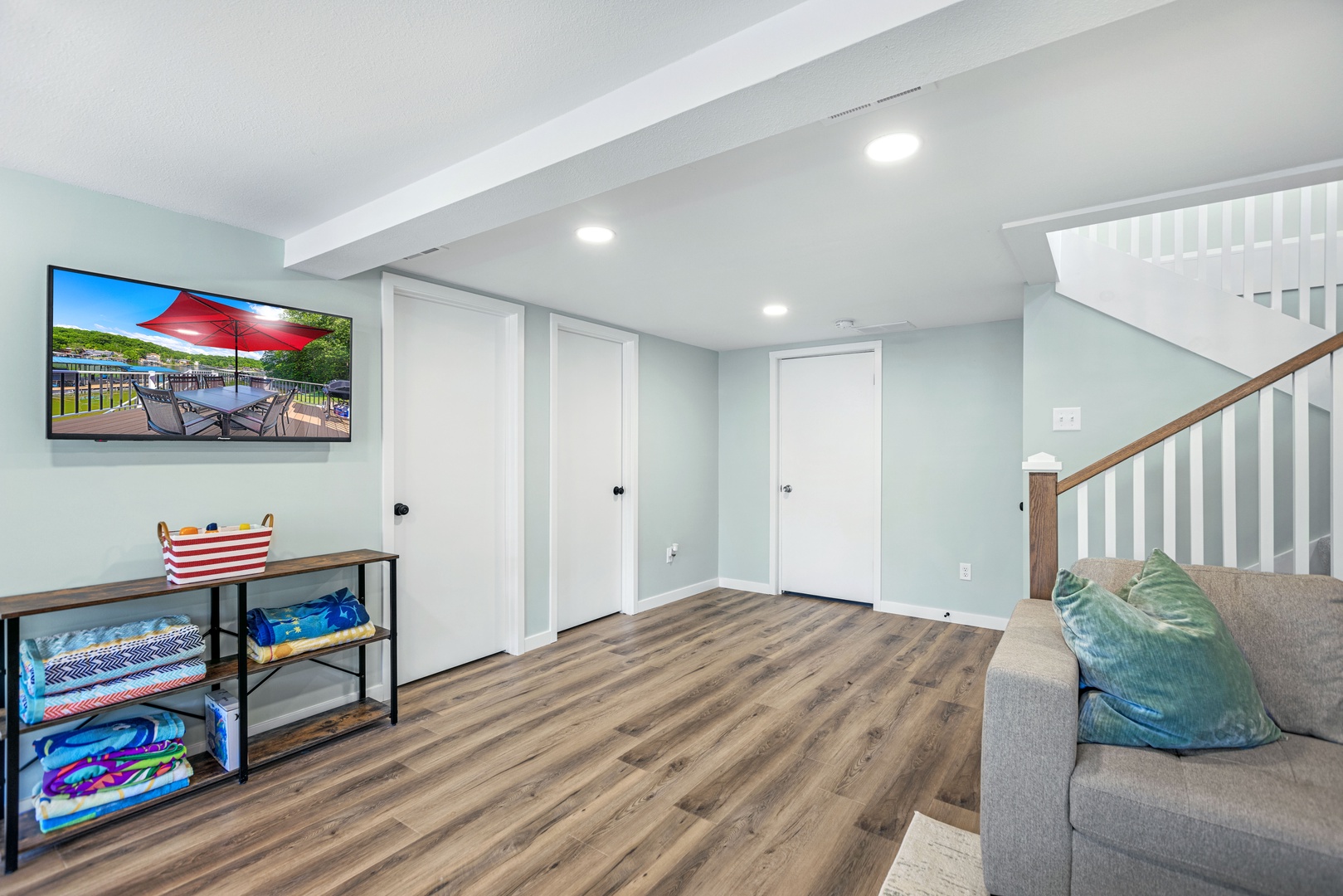 Basement space with sectional seating and Smart TV