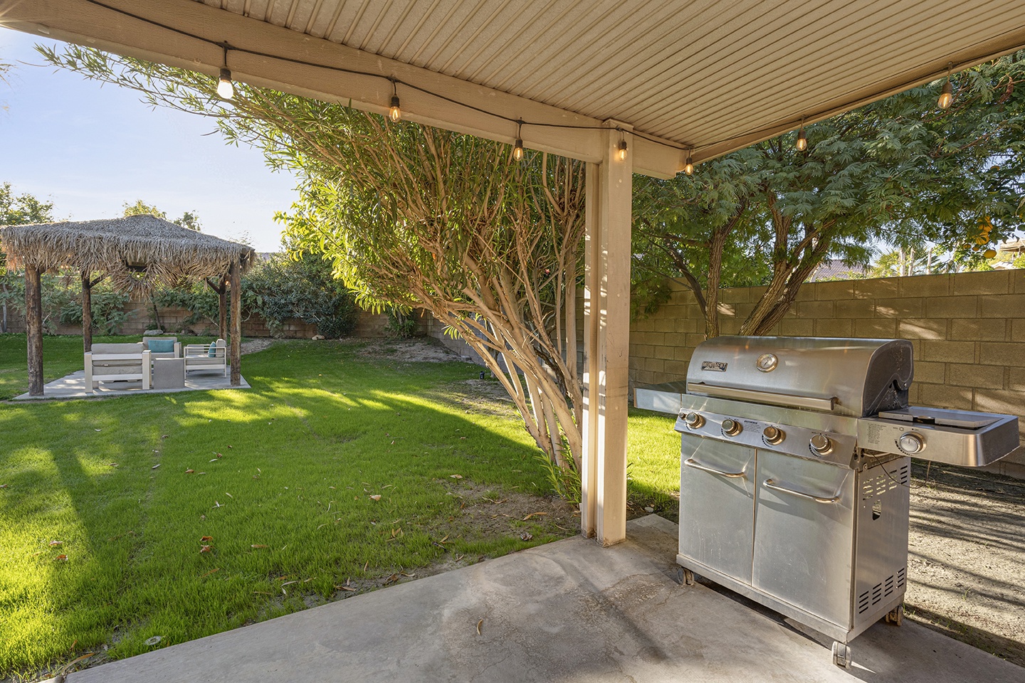 Dine al fresco on the covered patio with gas BBQ grill