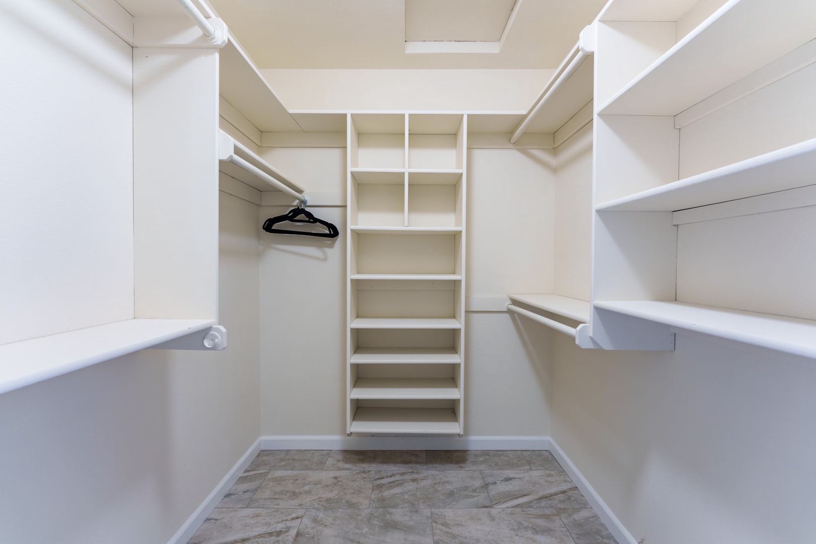 The Master Suite boasts an oversized walk-in closet with plenty of space to keep bags tucked away