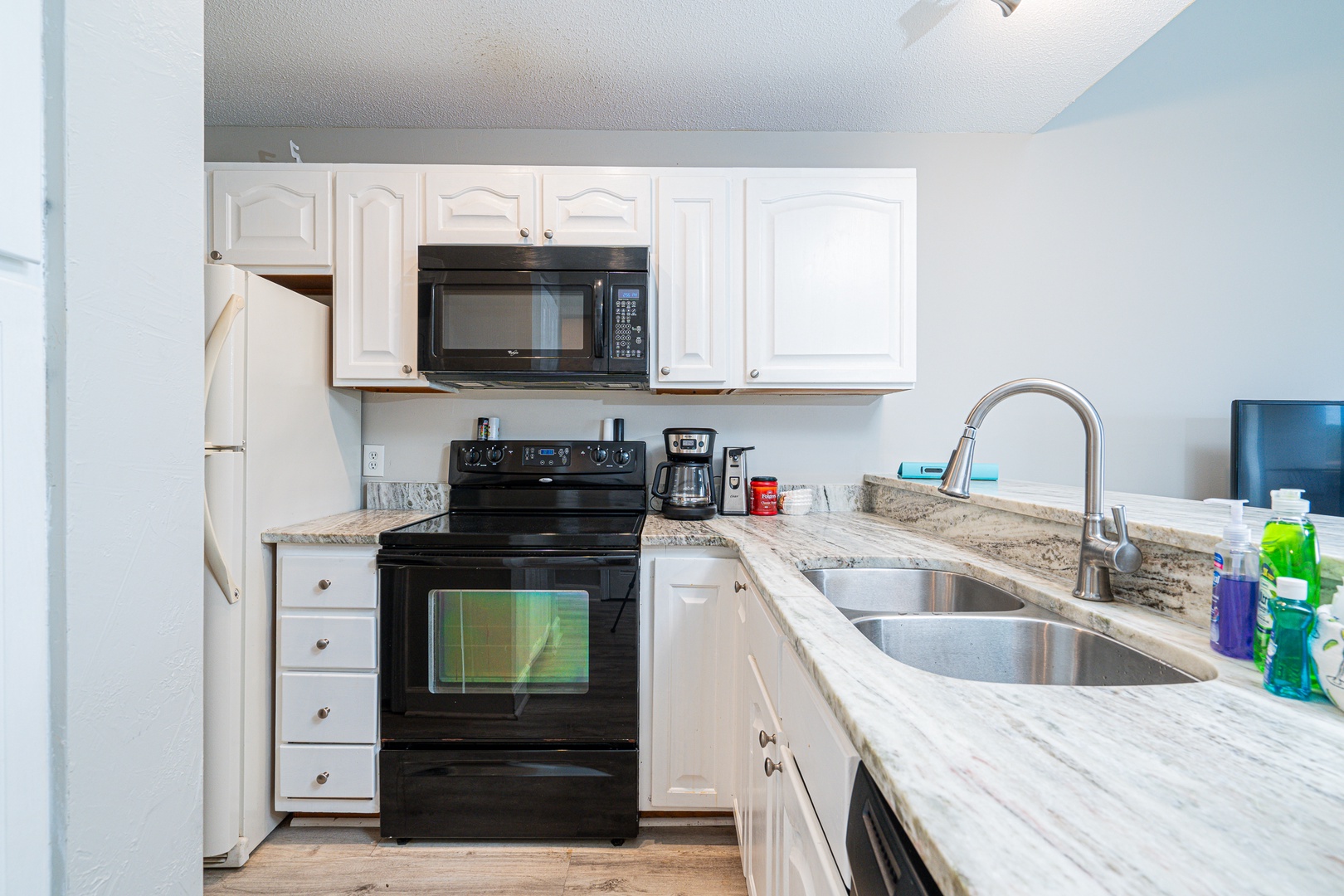 The inviting kitchen offers loads of space & all the comforts of home