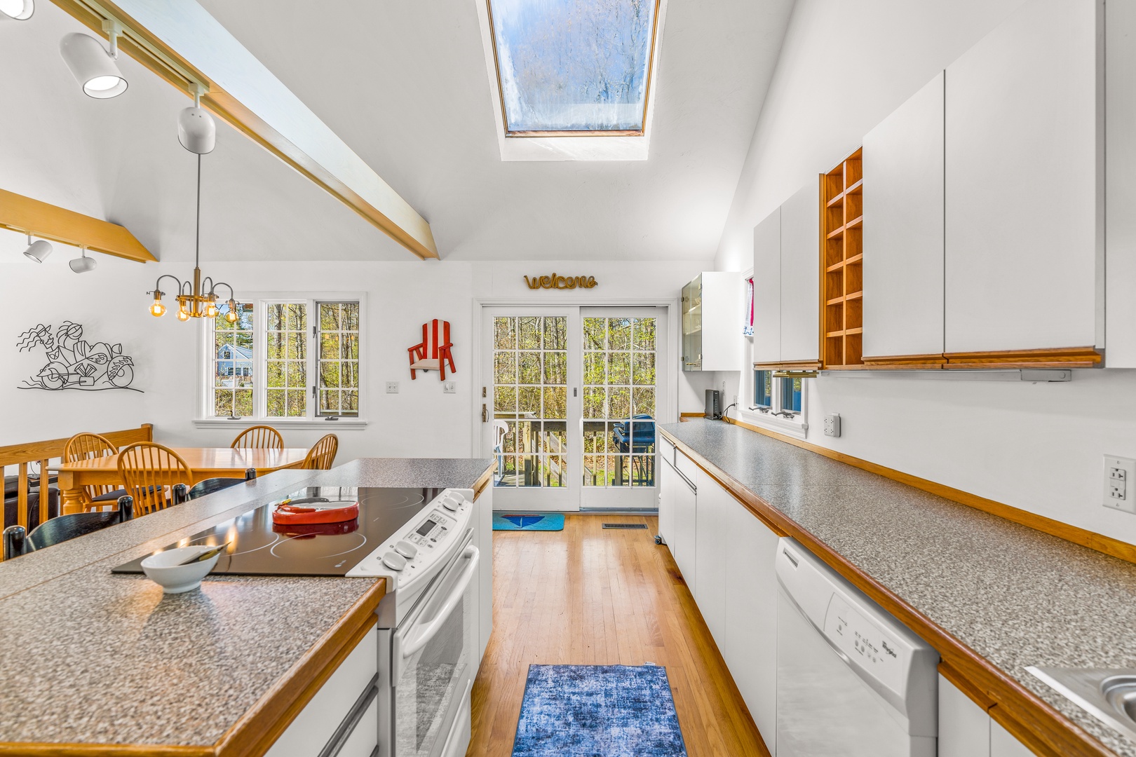 The bright, open kitchen offers ample space & all the comforts of home