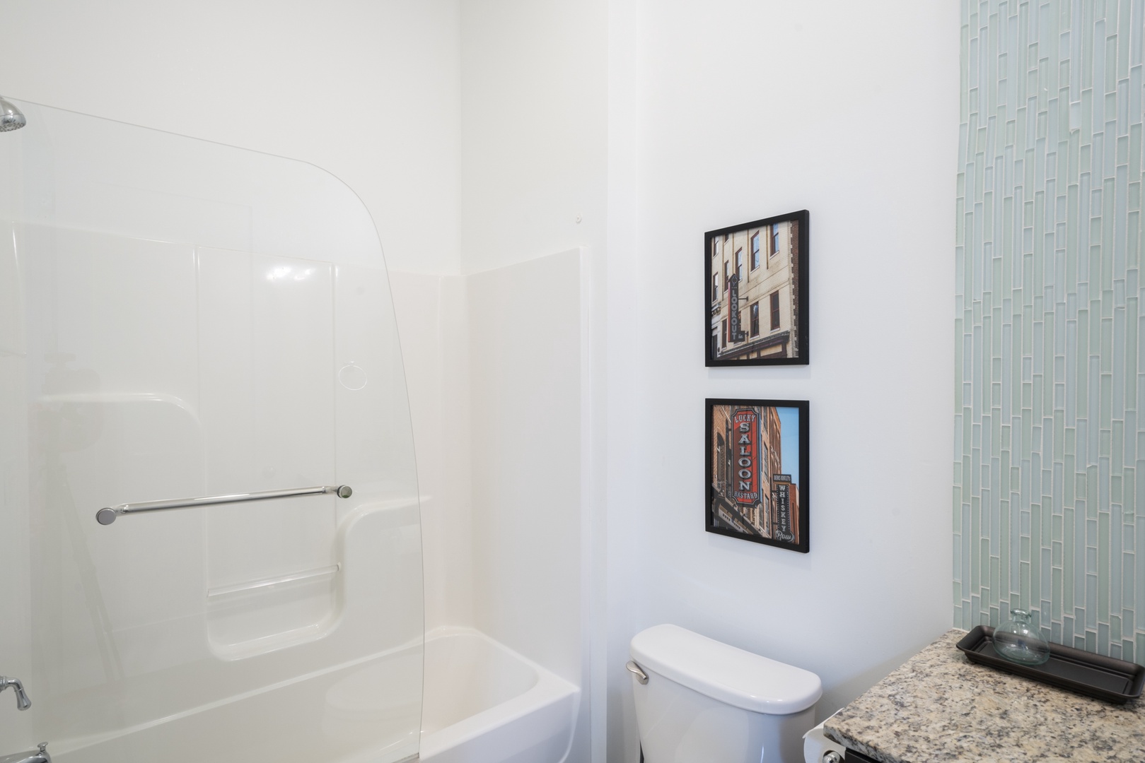 The full bathroom offers a large single vanity & shower/tub combo