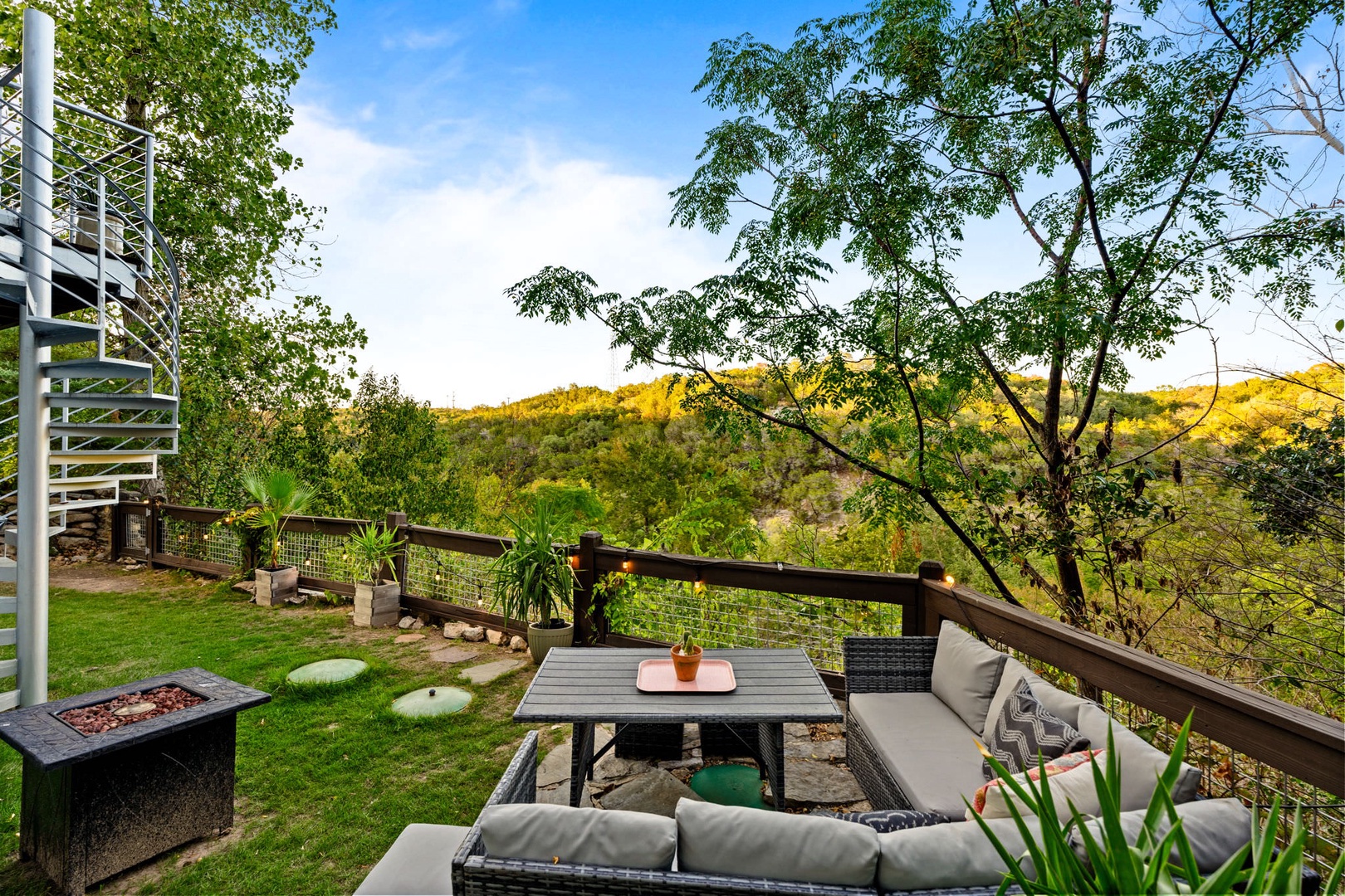 Large back deck with outdoor seating, fire pit and endless views