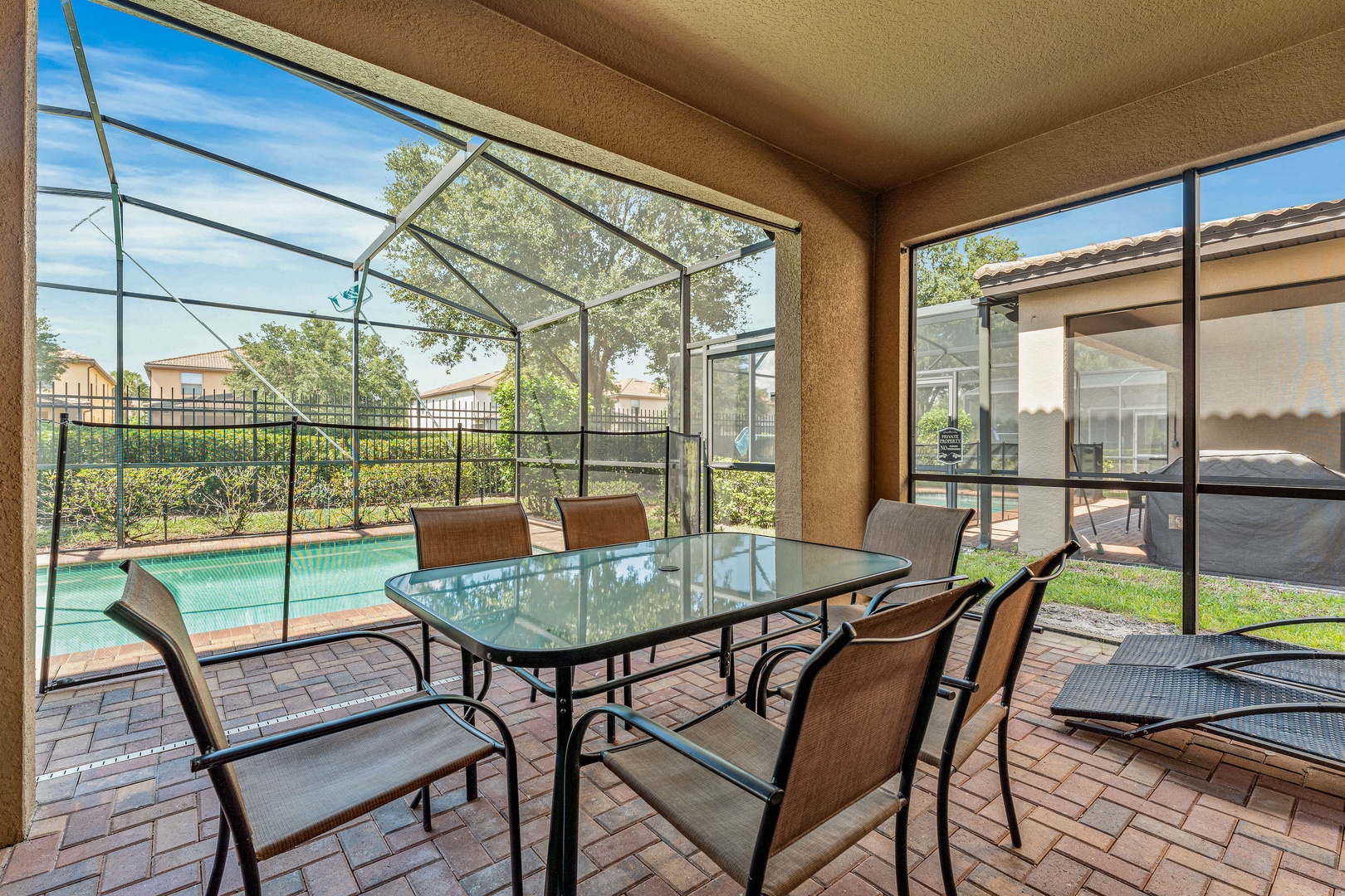 Screened in pool with outdoor seating