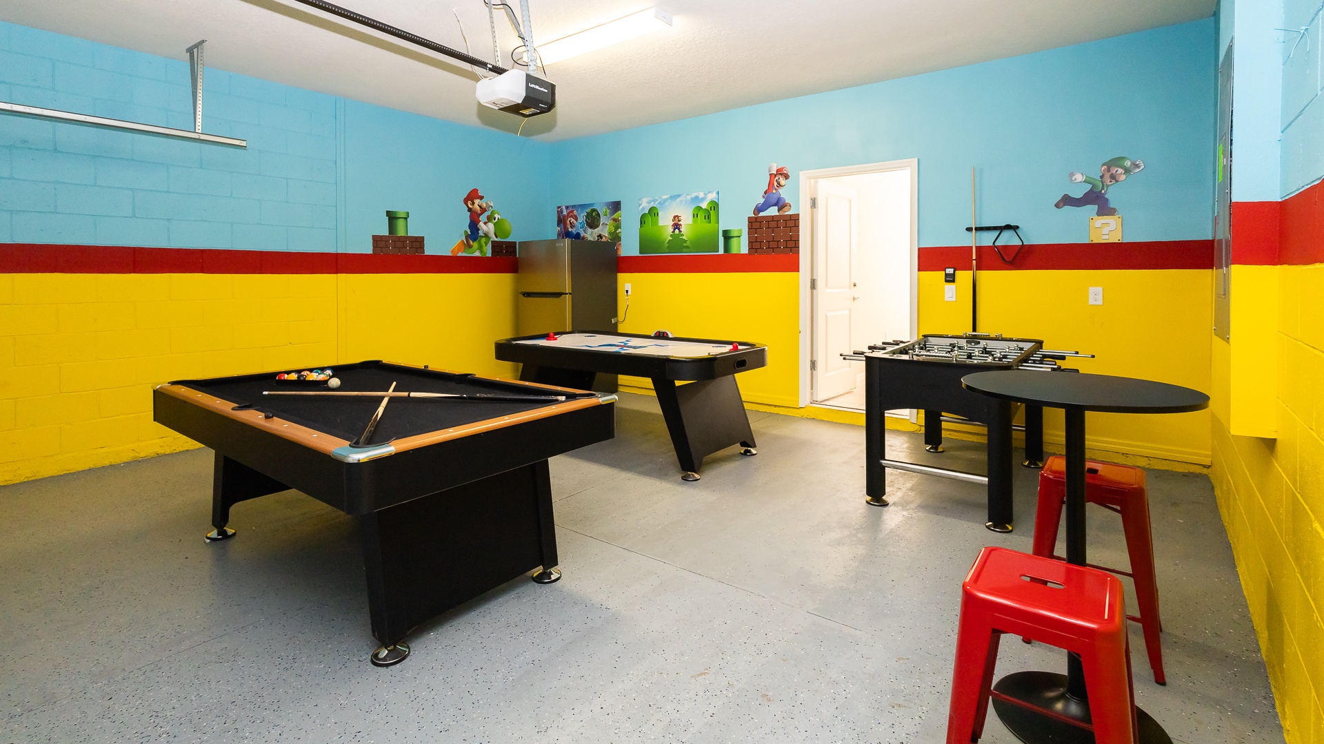 Get competitive in the garage game room with pool, air hockey, & foosball
