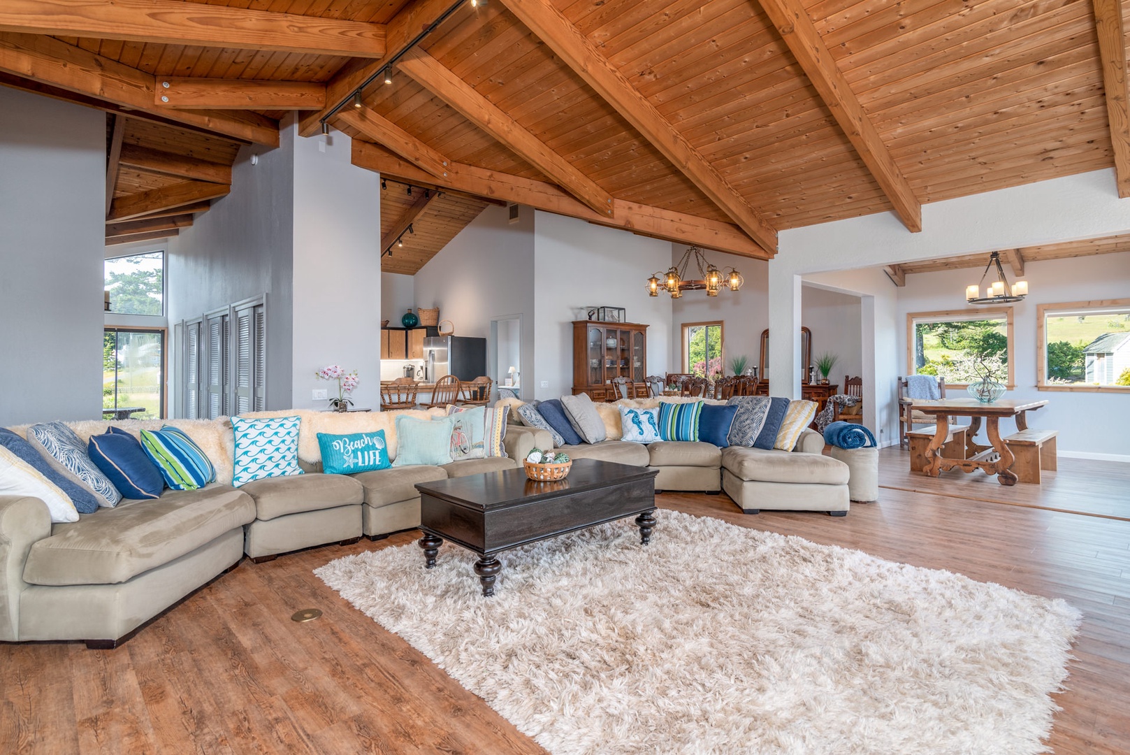 Open living space with ocean view, Smart TV, and gas fireplace