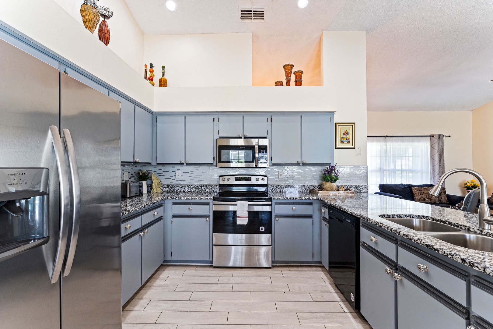 The open, airy kitchen offers ample space & all the comforts of home