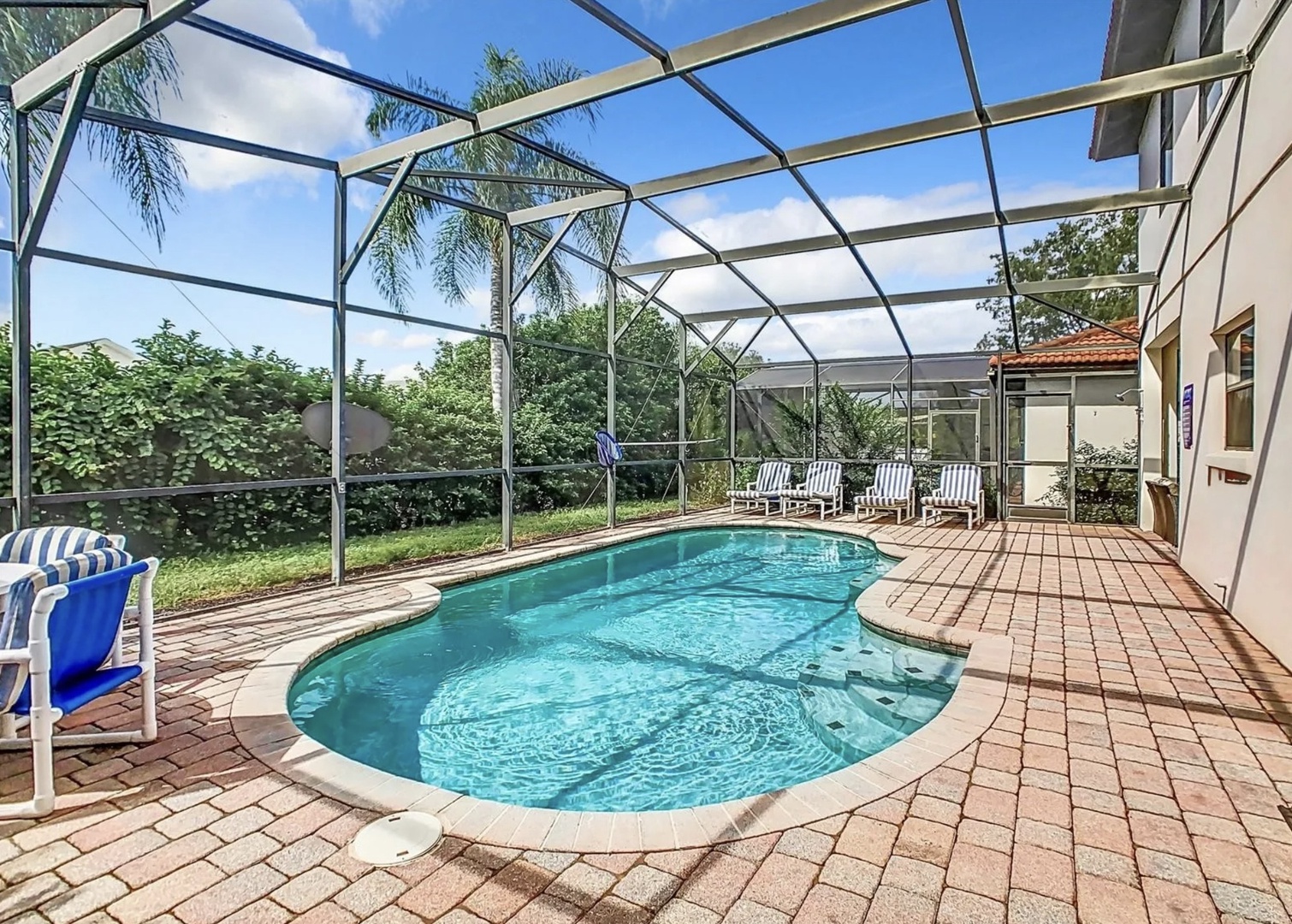 Private fenced in pool with outdoor seating