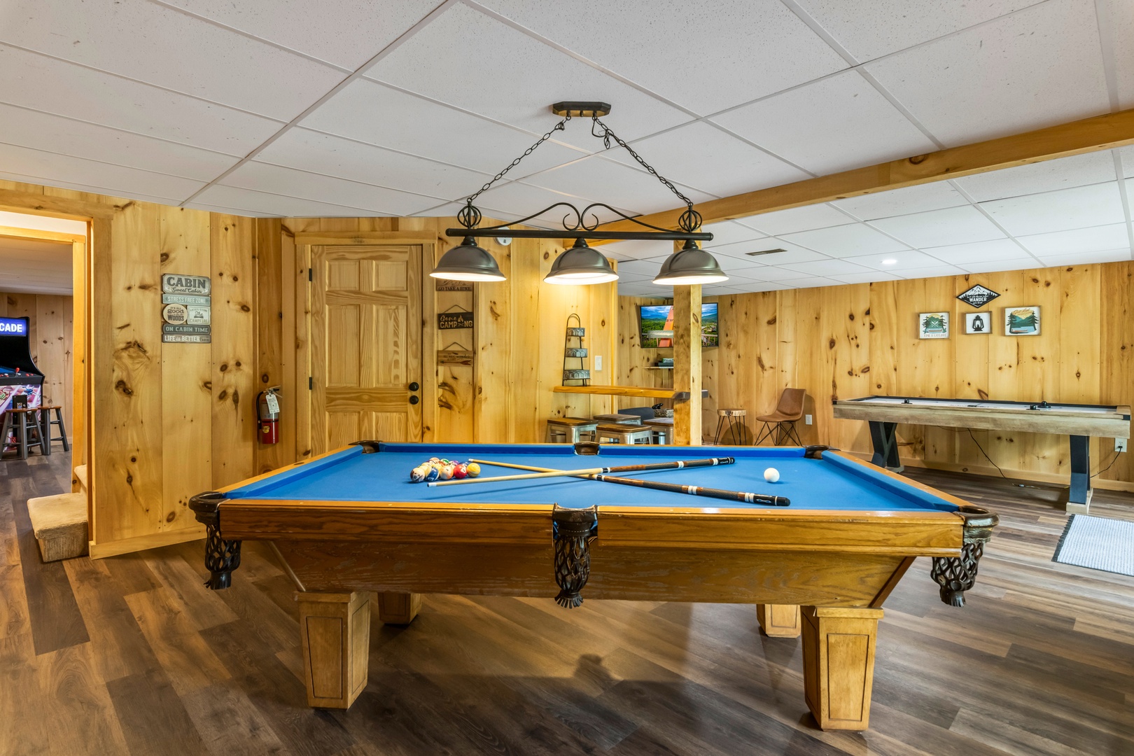 The lower-level game room offers gaming & relaxation options galore!