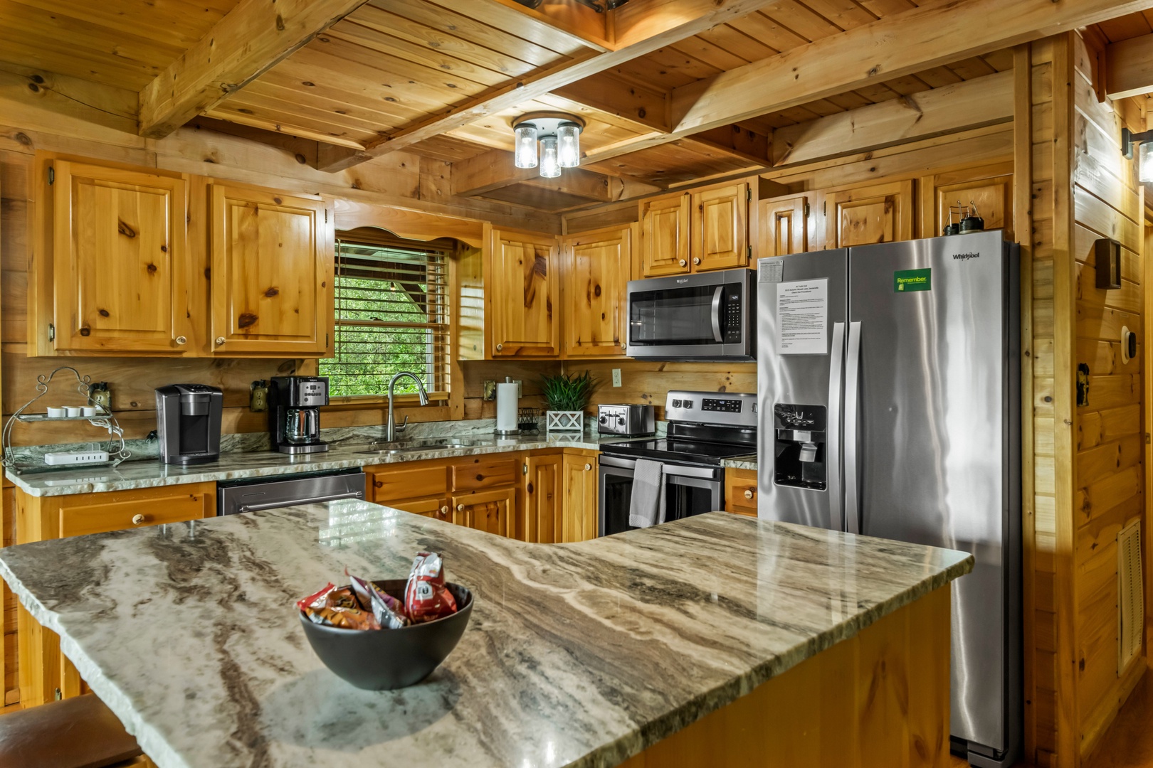 The inviting open kitchen offers ample space & all the comforts of home