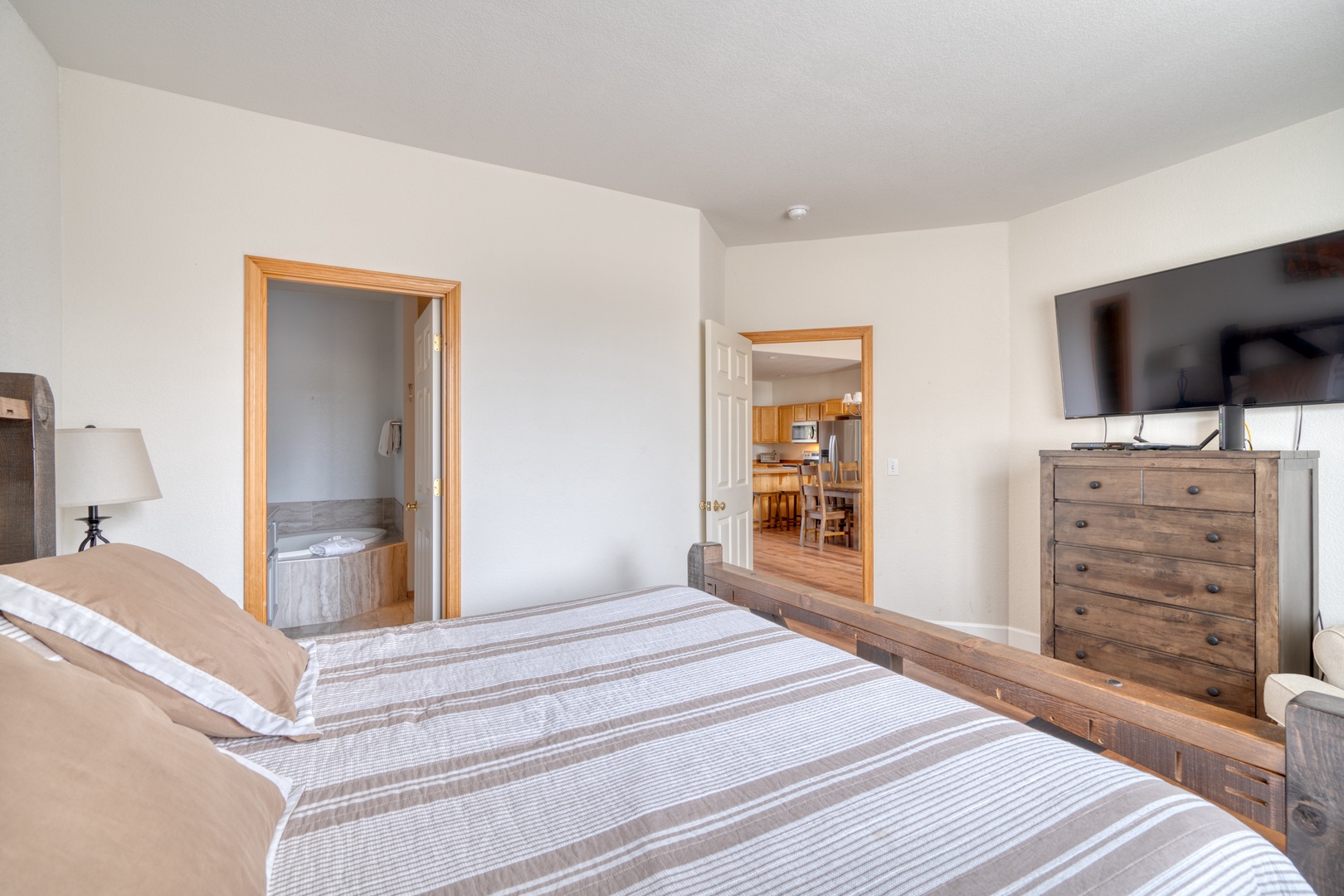 The 1st of 2 spacious king suites boasts a private ensuite & TV