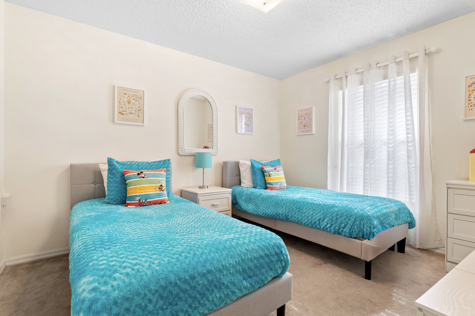 Two cozy twin beds await in the first bedroom retreat