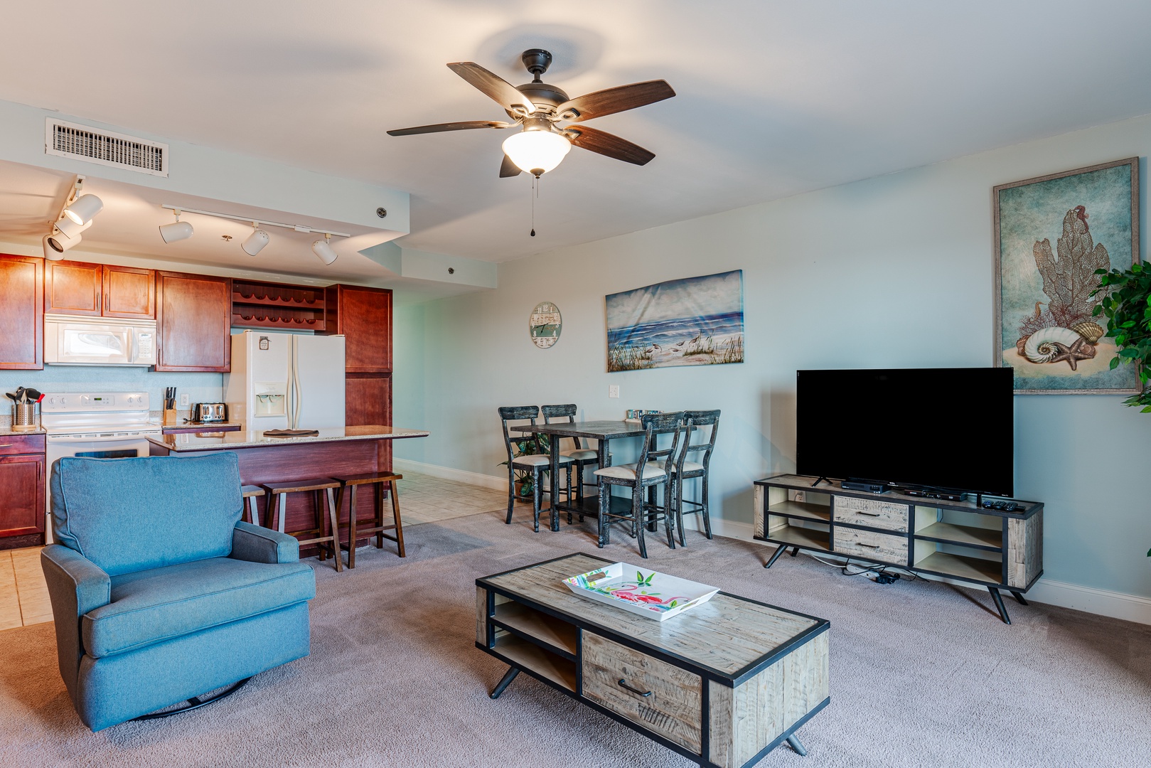 Bright open living space with sofa sleeper, TV, and breathtaking views