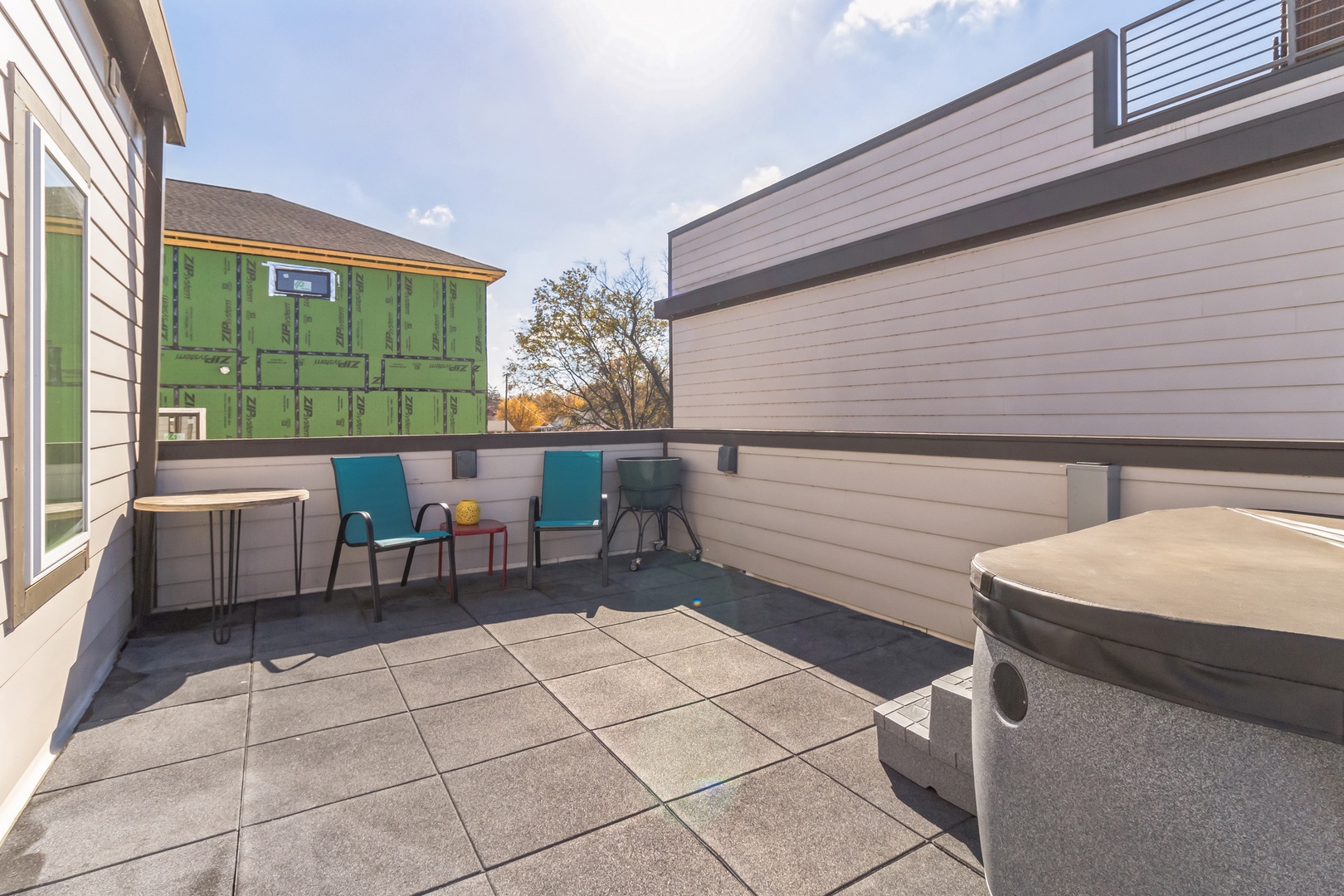 Step out onto the 2nd-level rooftop deck & soak your cares away in the hot tub