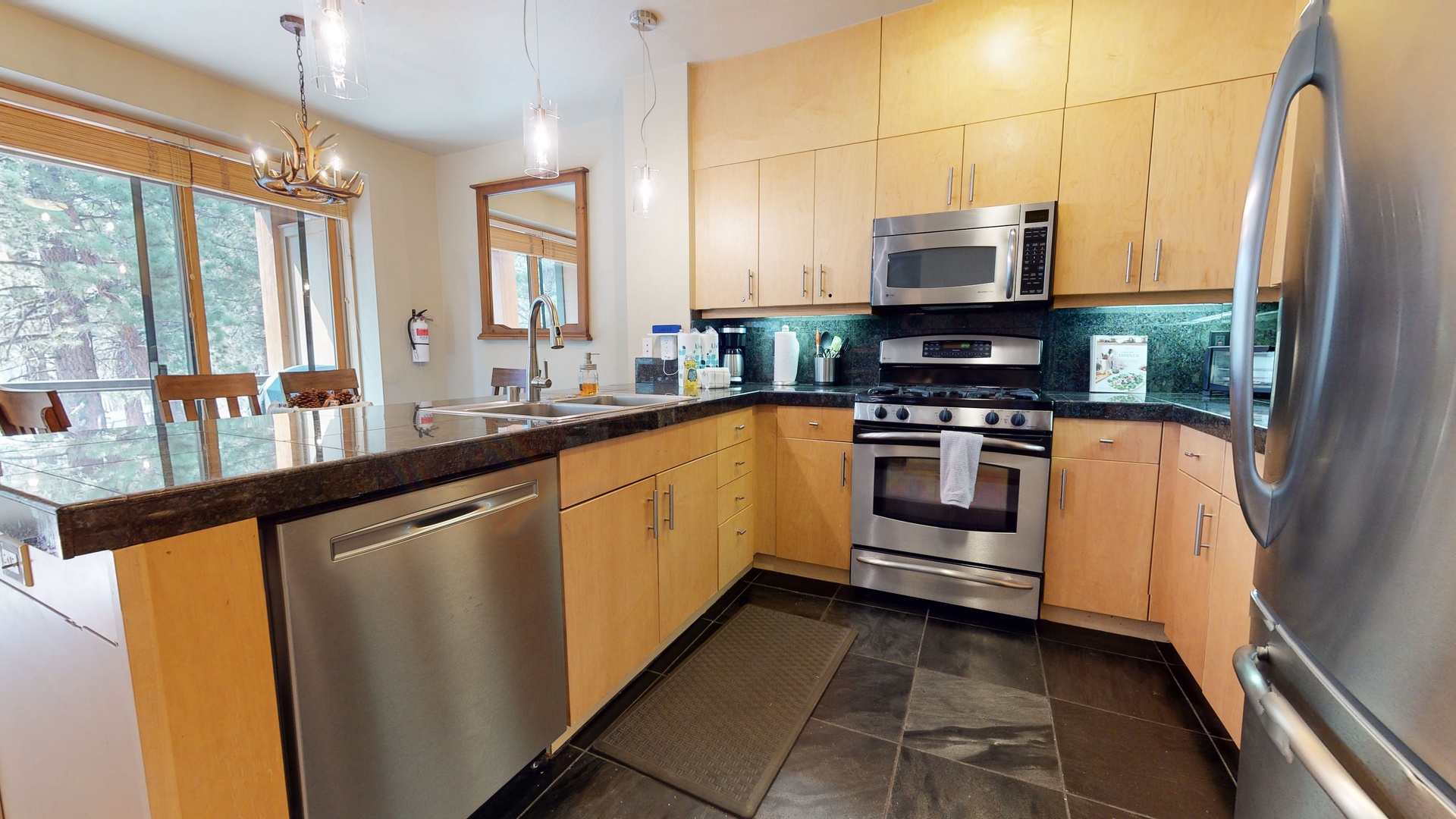 Kitchen with drip coffee maker, toaster oven, blender, and more