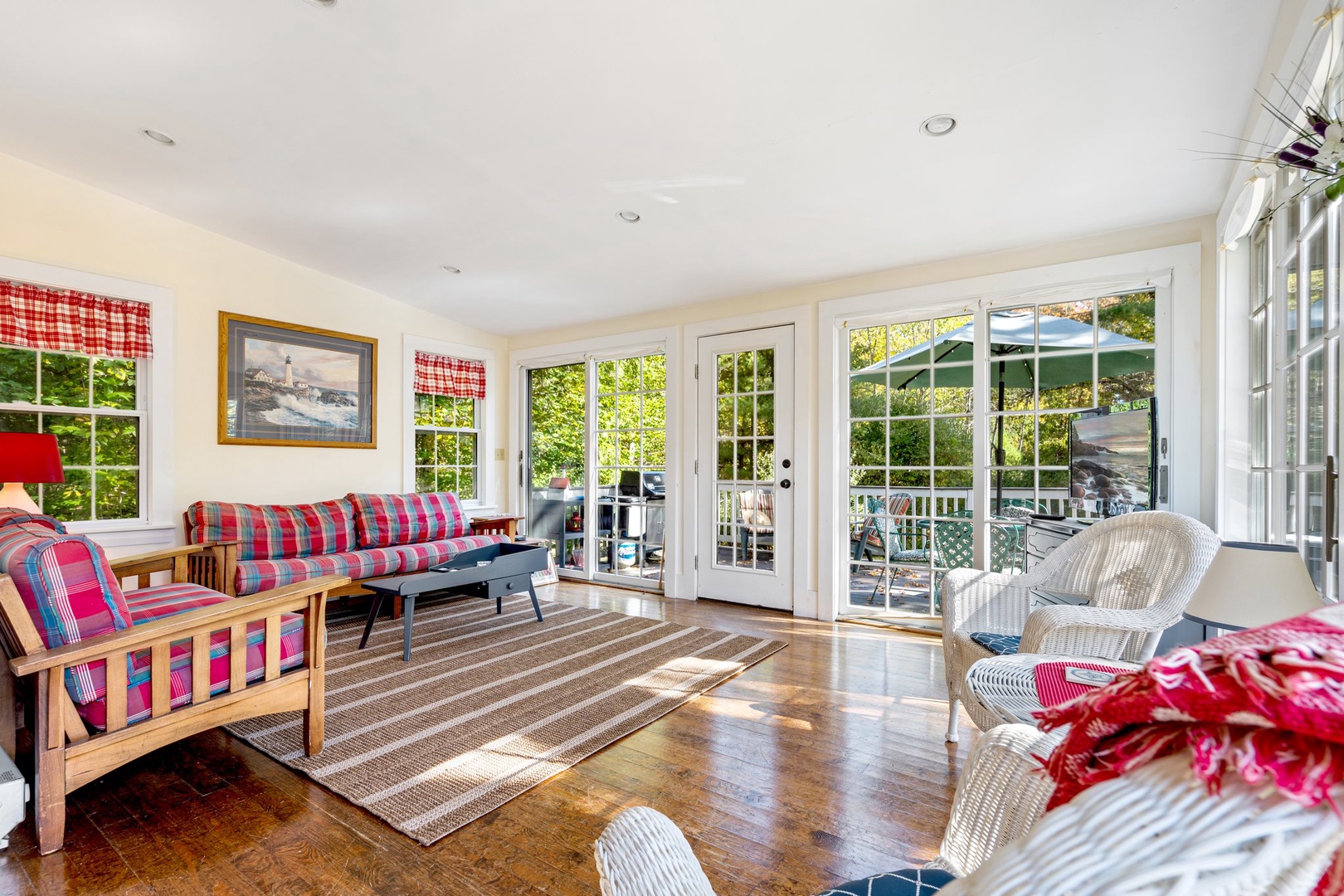 Bright living area with ample seating and Smart TV