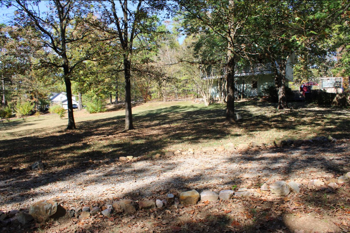 Outdoor scene with swing and fire pit