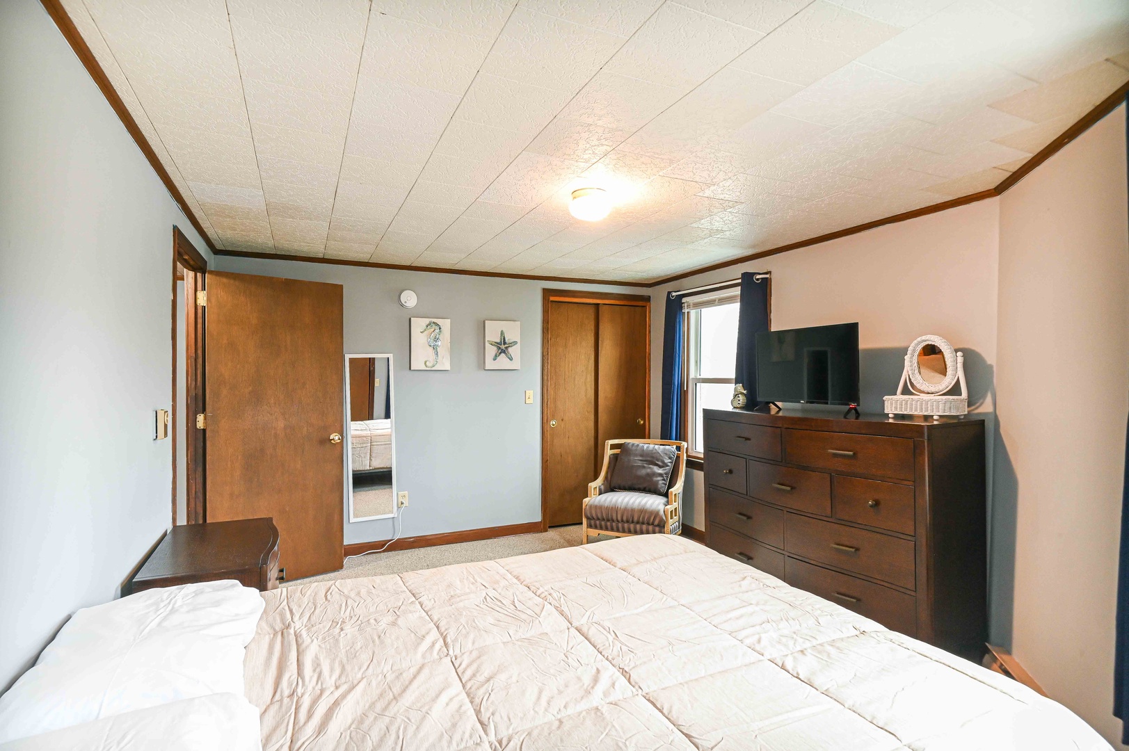 Bedroom 1 with queen bed, and Smart TV