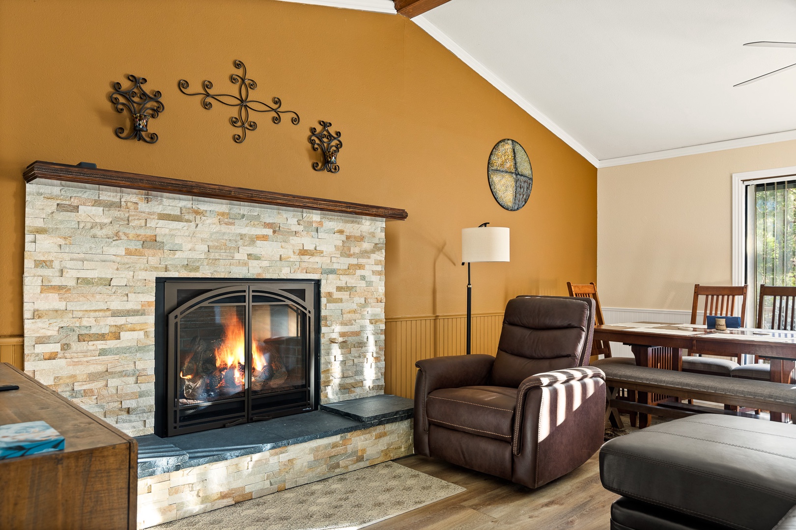 Curl up in the inviting living room to enjoy a movie by the fireplace