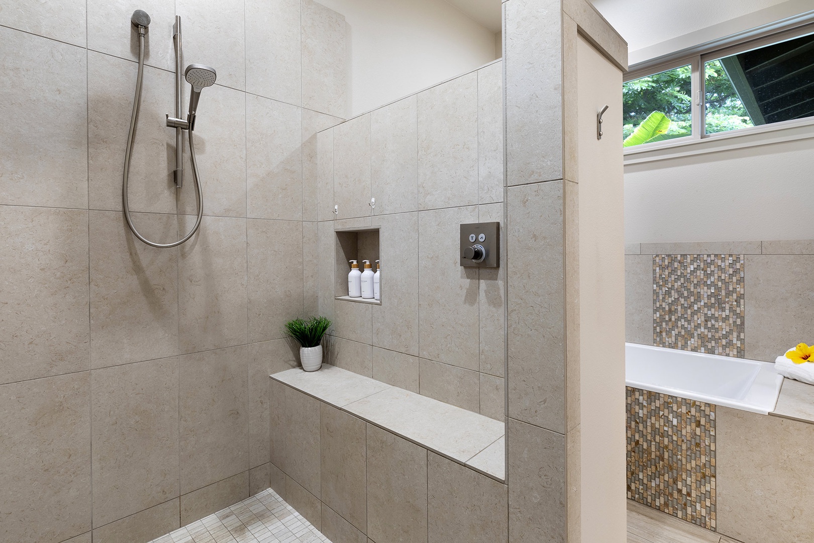 Master ensuite with dual sinks, walk-in shower, and soaking tub