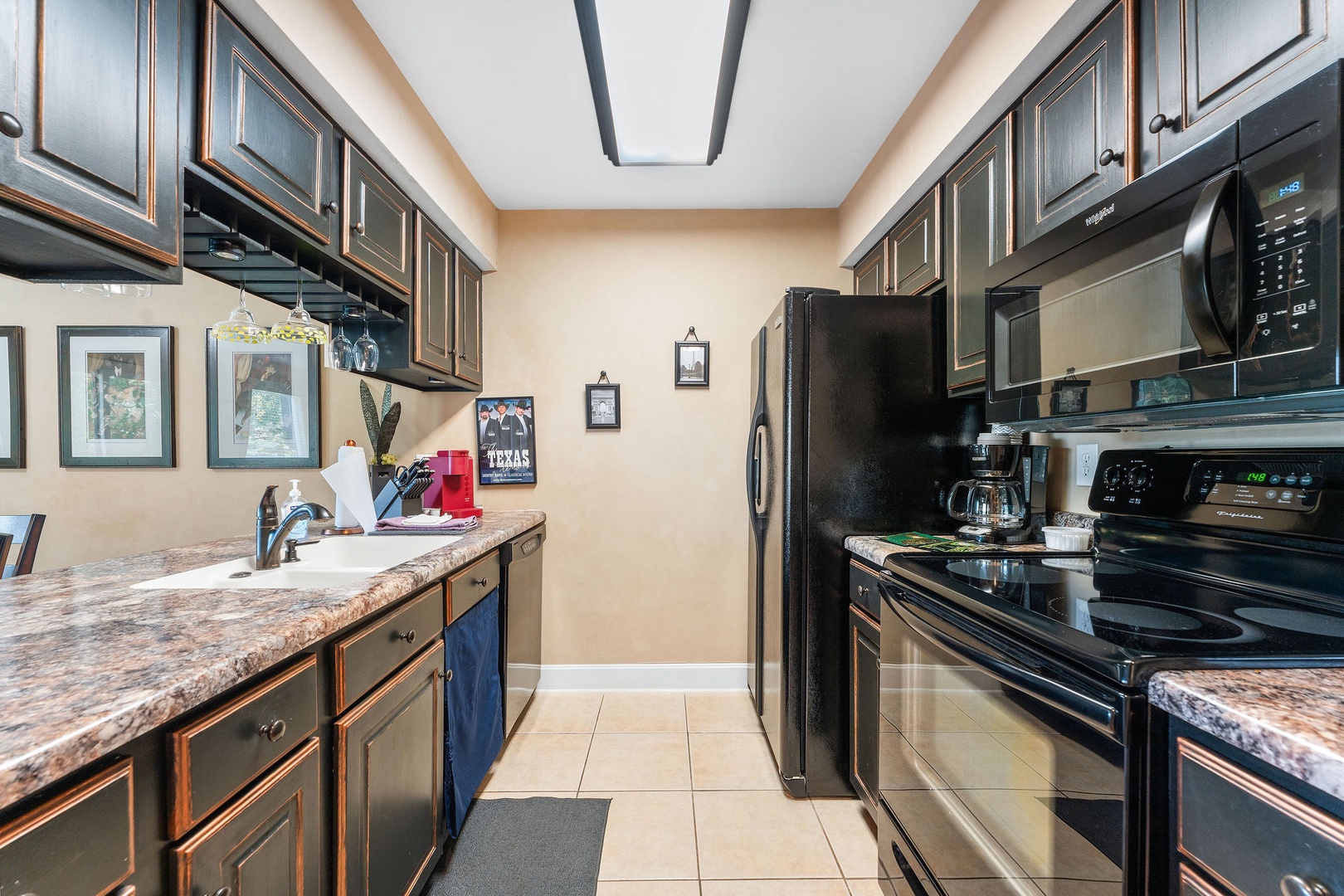 The open, airy kitchen offers ample space & every home comfort