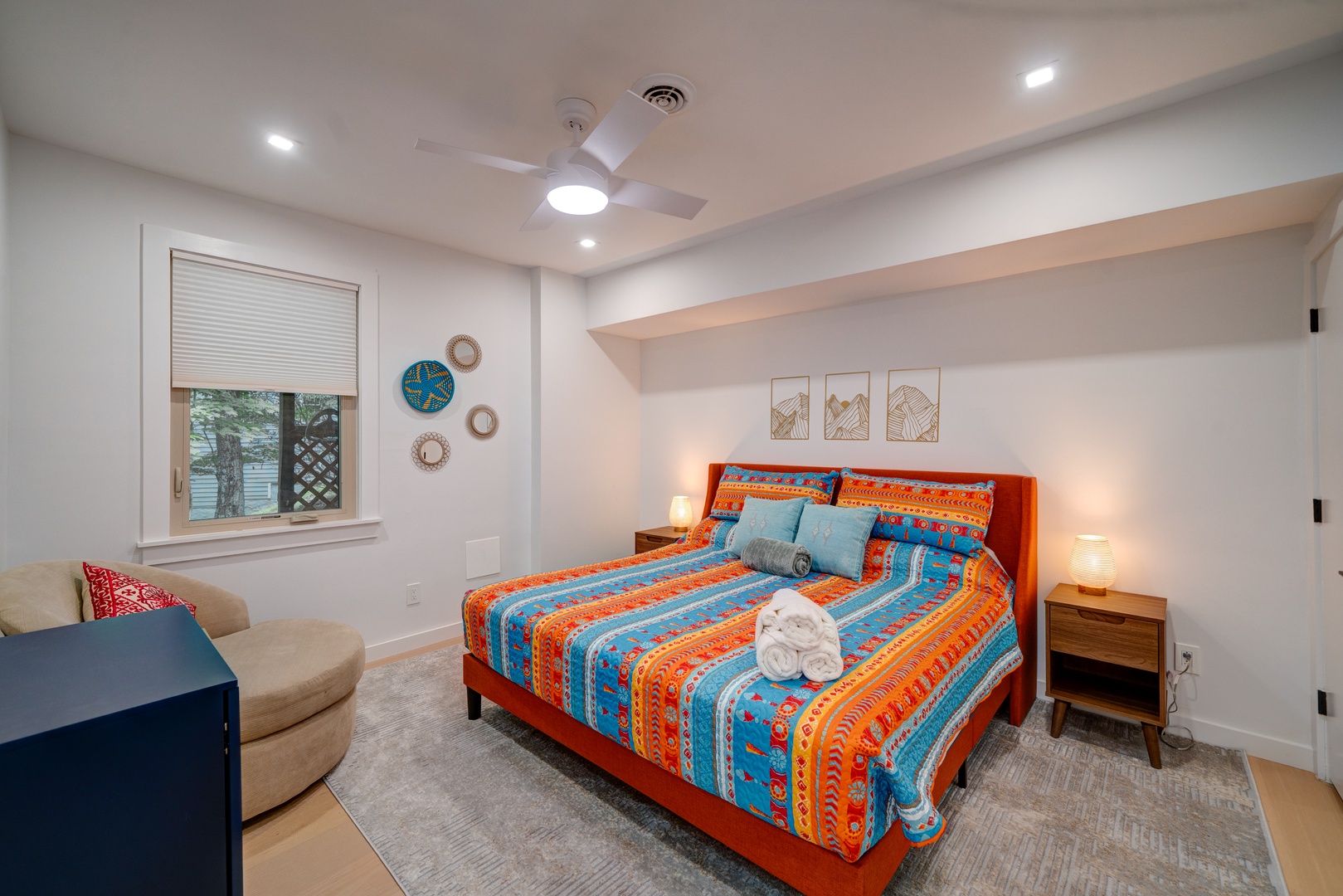 Kick back & relax in this colorful bedroom retreat, offering a king-sized bed