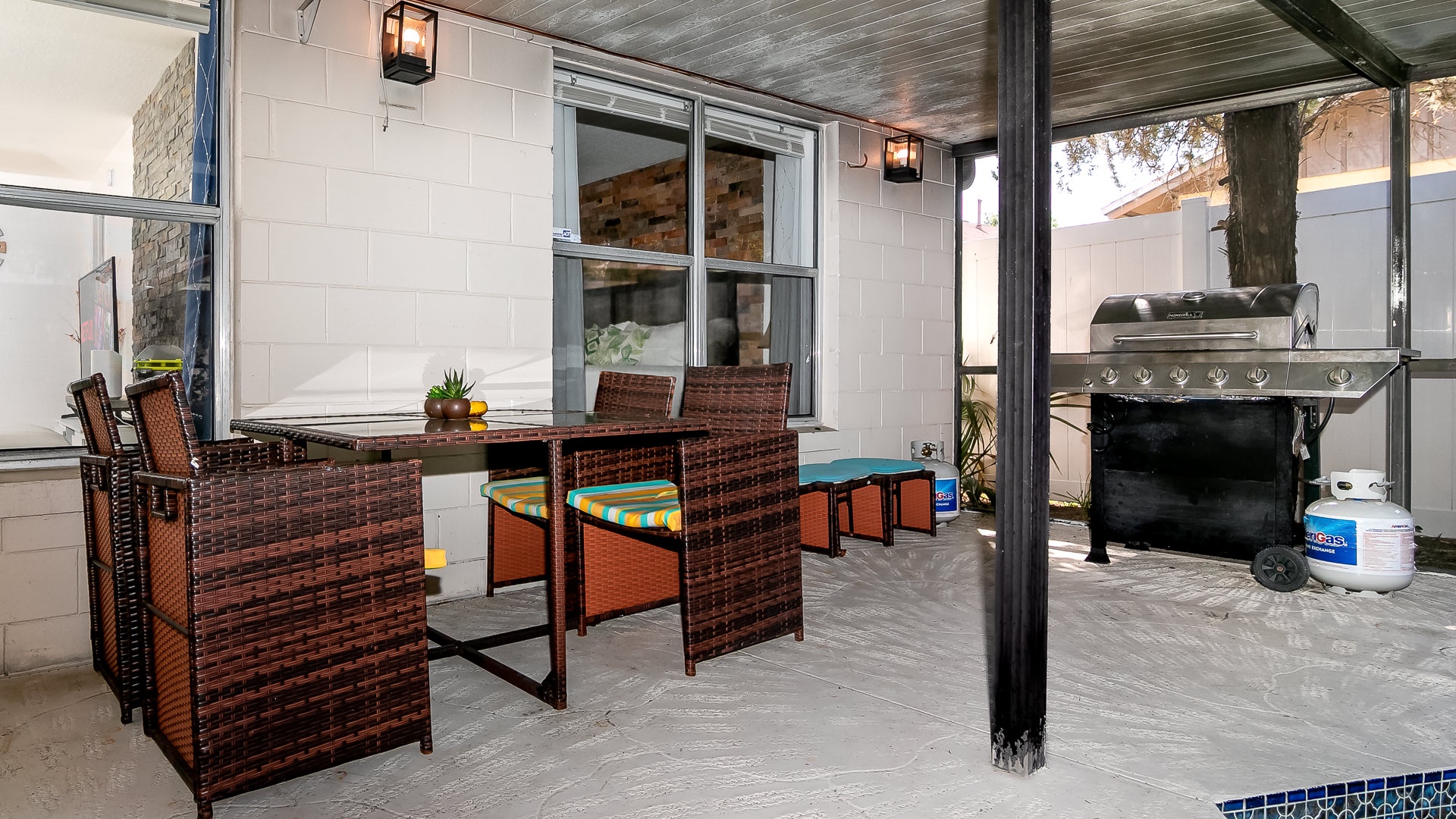 Outdoor dining and BBQ grill by the pool