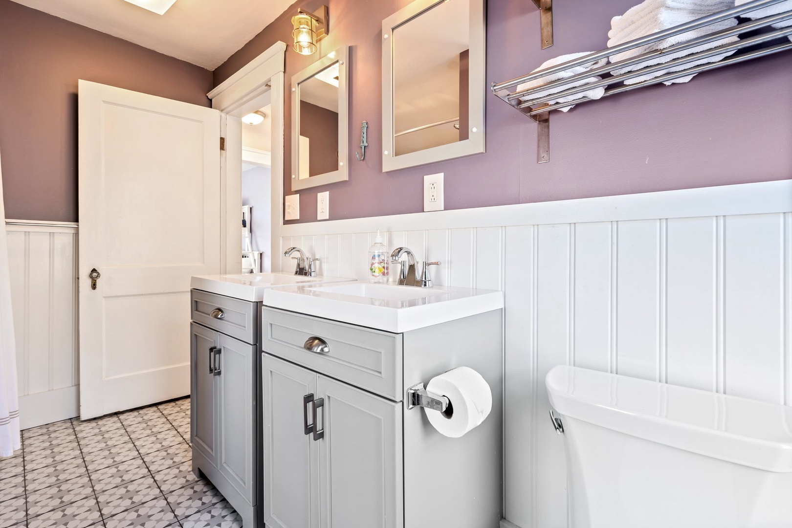 A double vanity, shower/tub combo available on the first floor shared bath