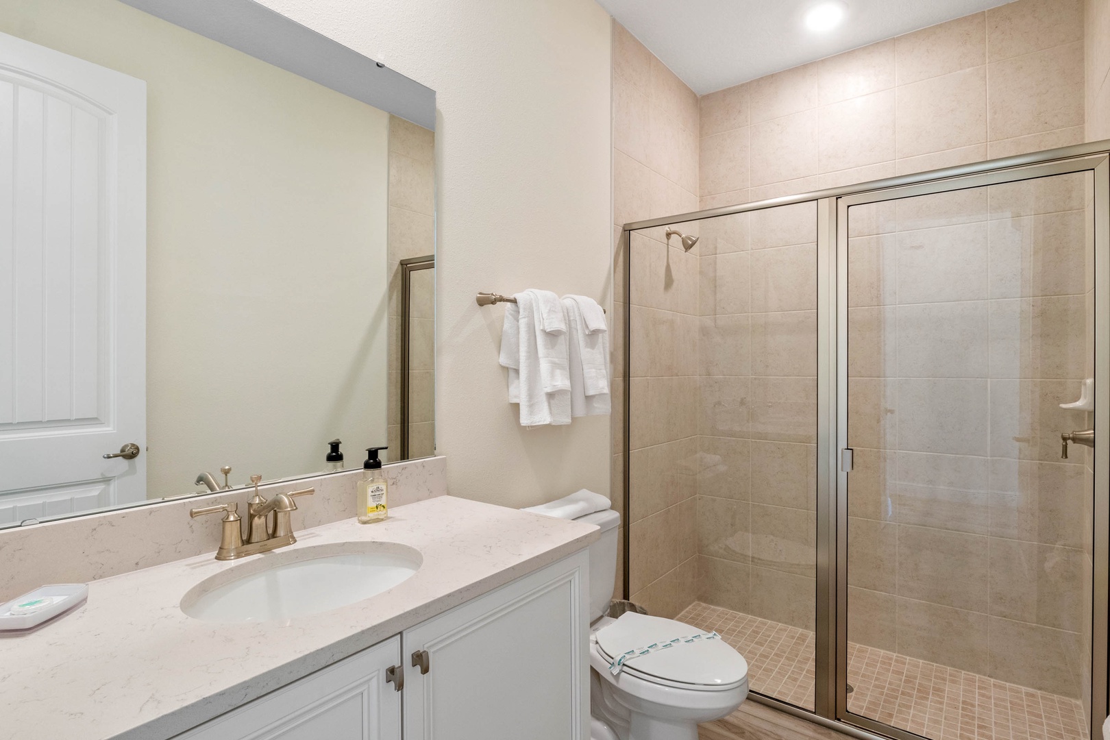 Shared Bathroom with Single Vanity and Glass-Enclosed Shower