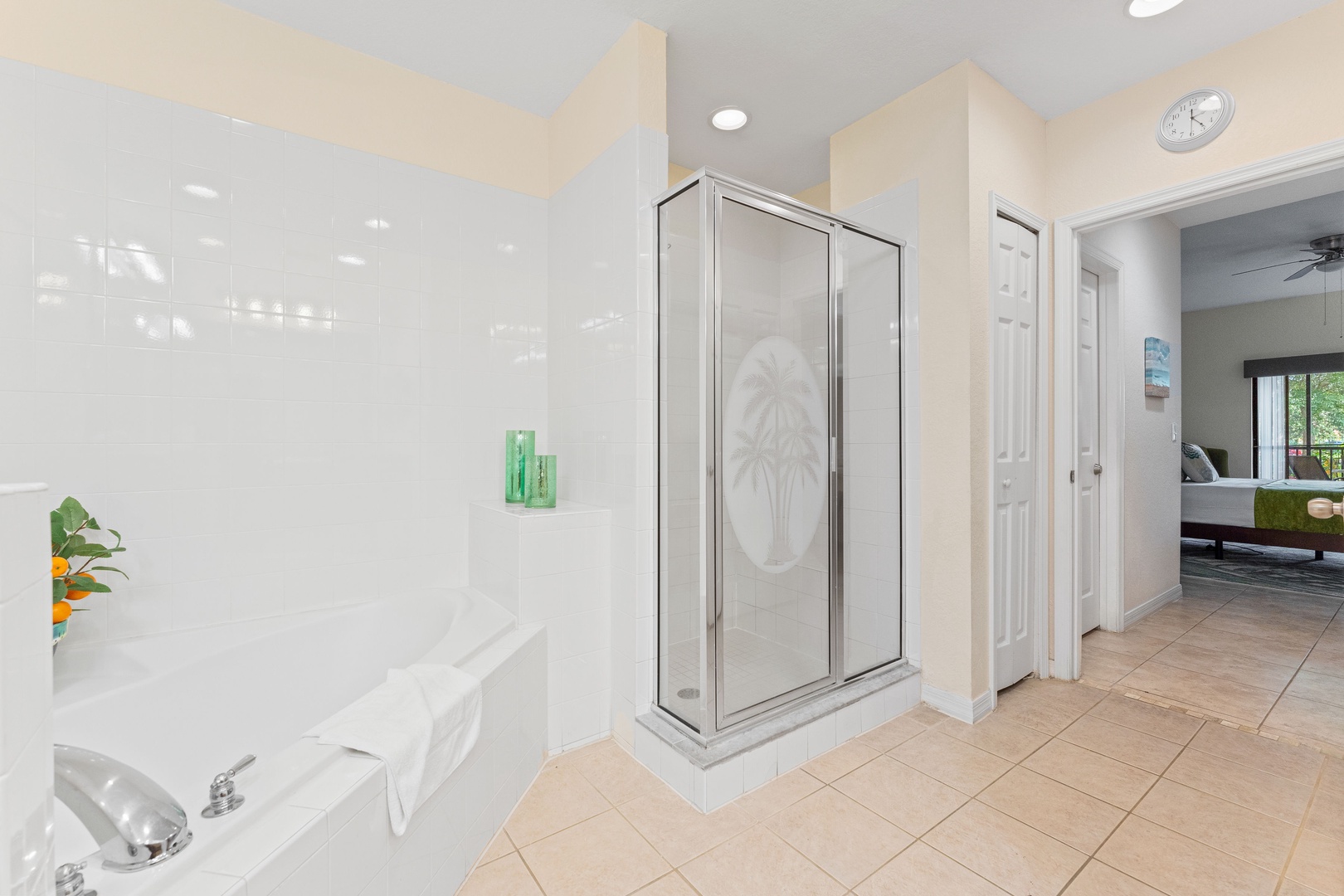 A double vanity, shower, & tub await in the ensuite bath