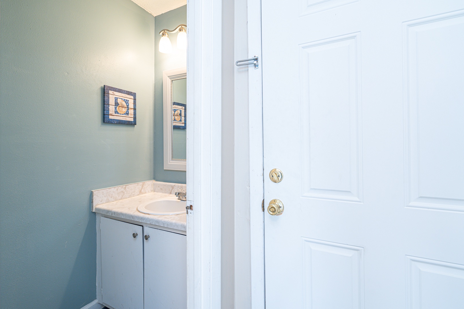 A convenient half bath is available just off the entryway