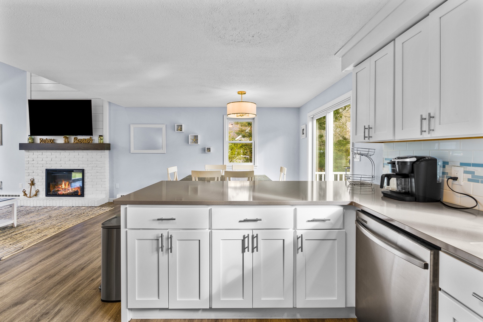 The open, airy kitchen offers ample space & all the comforts of home