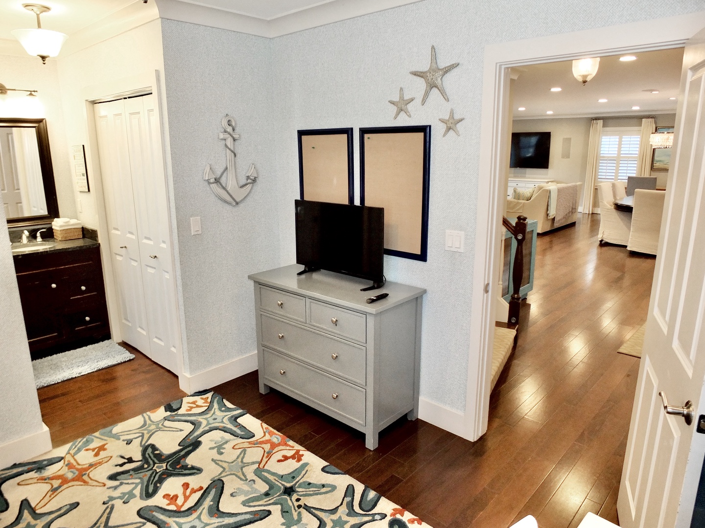 This beachy bedroom offers a twin-over-twin bunkbed, ensuite, & Smart TV