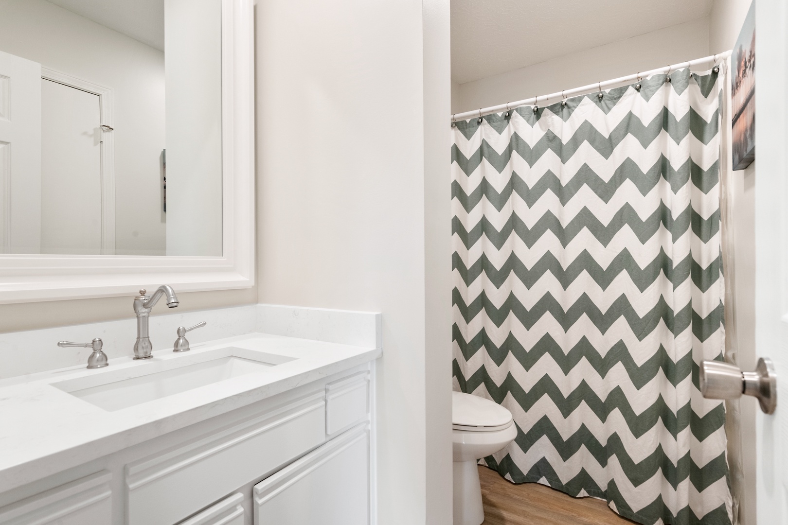 Wash up in the final full bath, featuring a single vanity & shower/tub combo