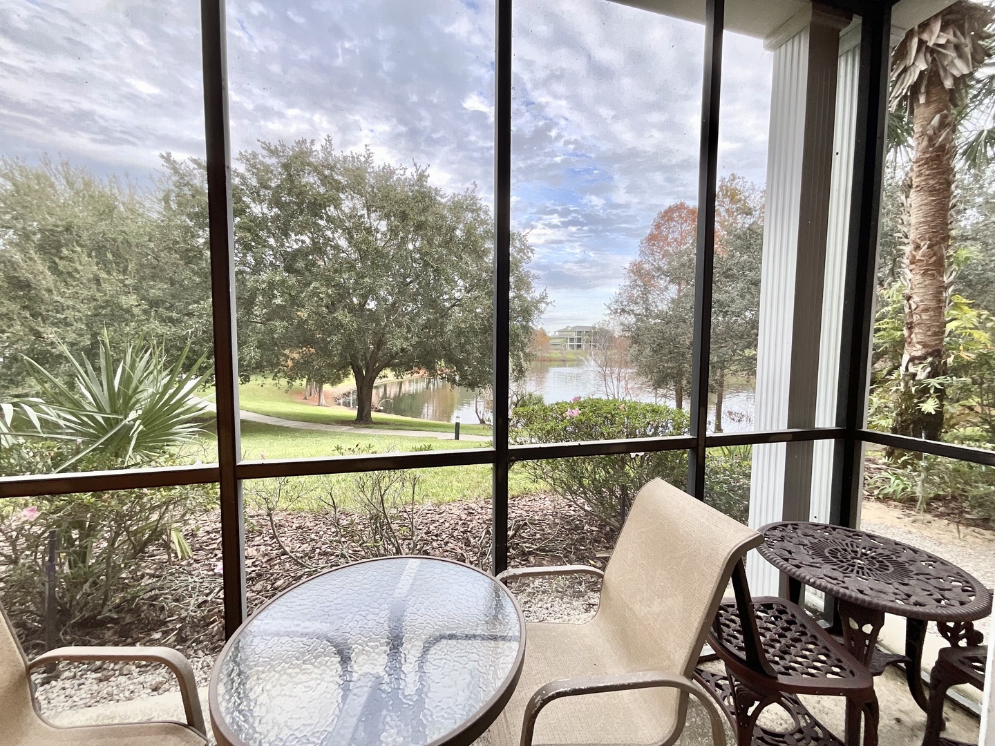 Lounge or dine with stunning water views on the screened patio