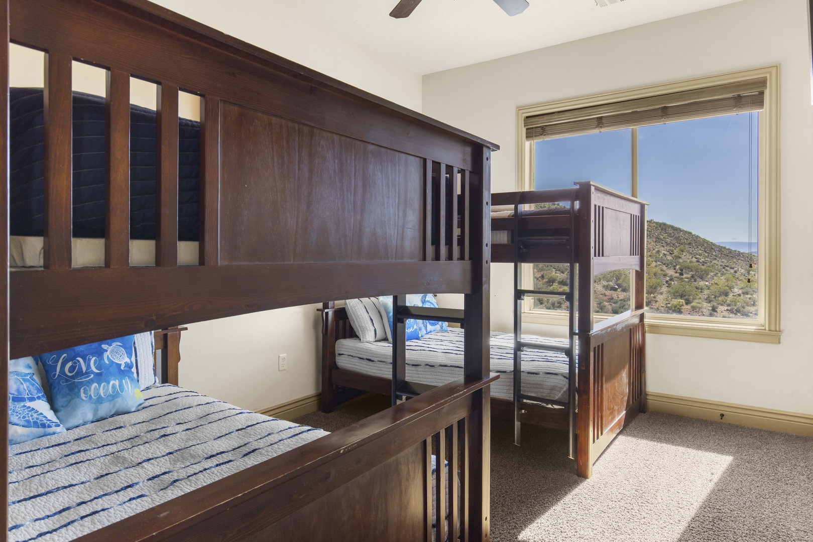 The bunk bedroom offers a pair of full-over-full bunkbeds & Smart TV