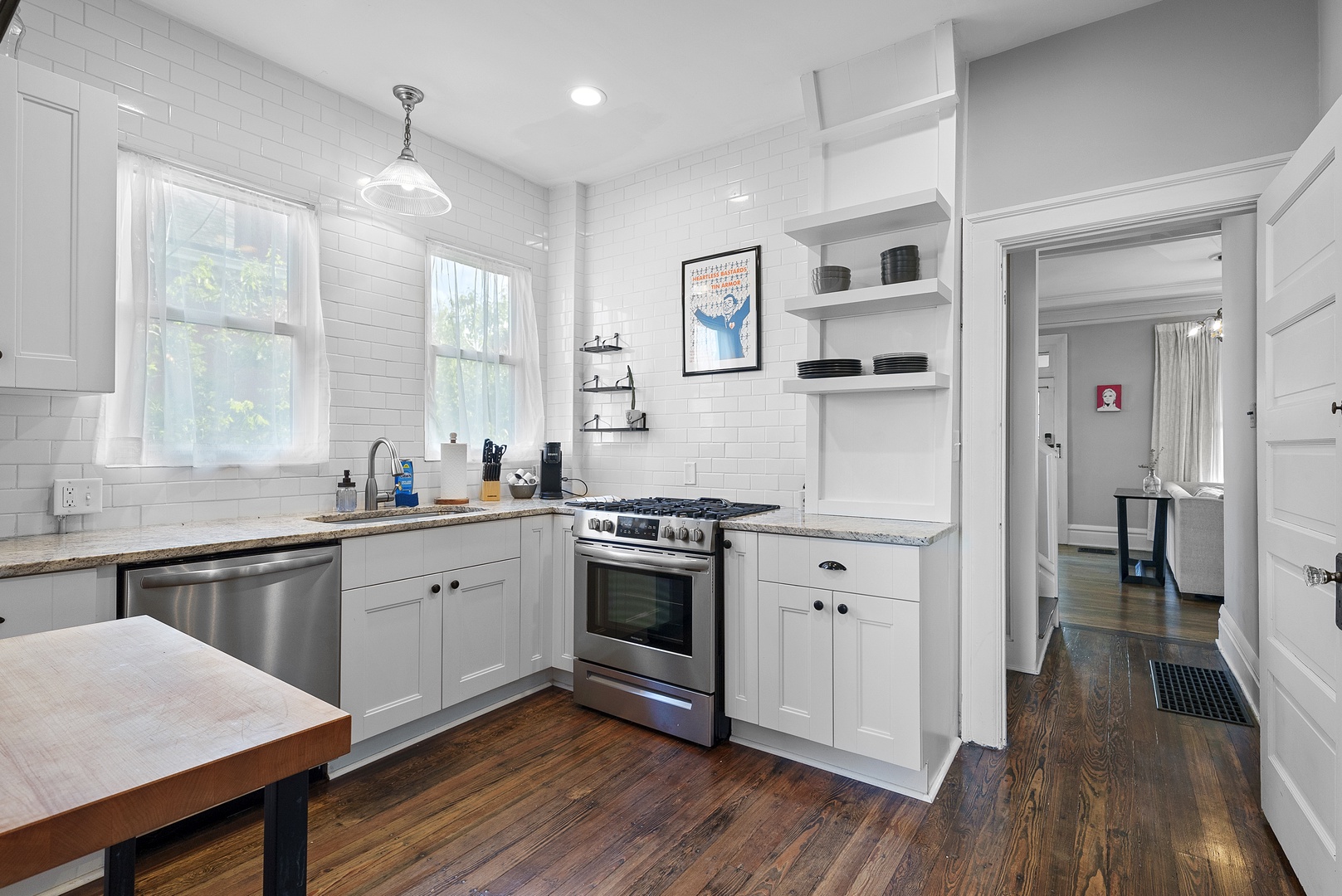 The bright, updated kitchen offers ample space & all the comforts of home