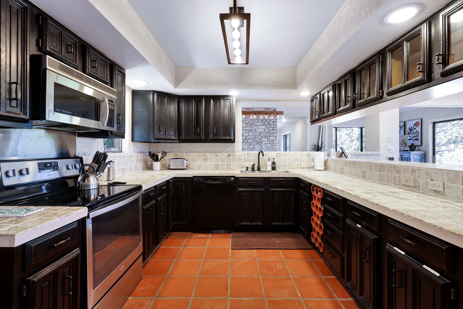 The sleek, open kitchen offers ample space & all the comforts of home