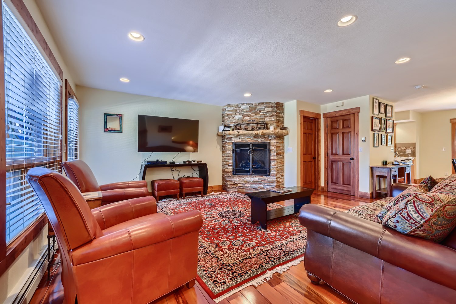 Living room with TV, and gas fireplace