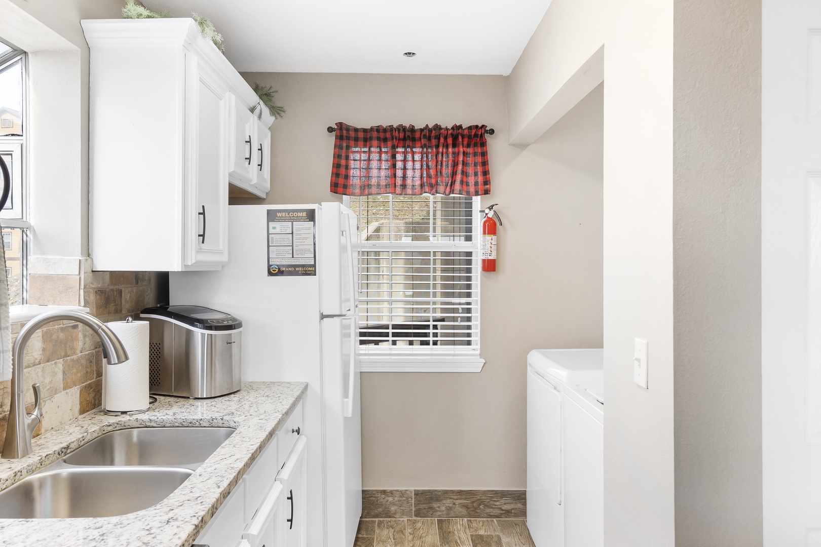 The cheerful kitchen offers ample space & all the comforts of home
