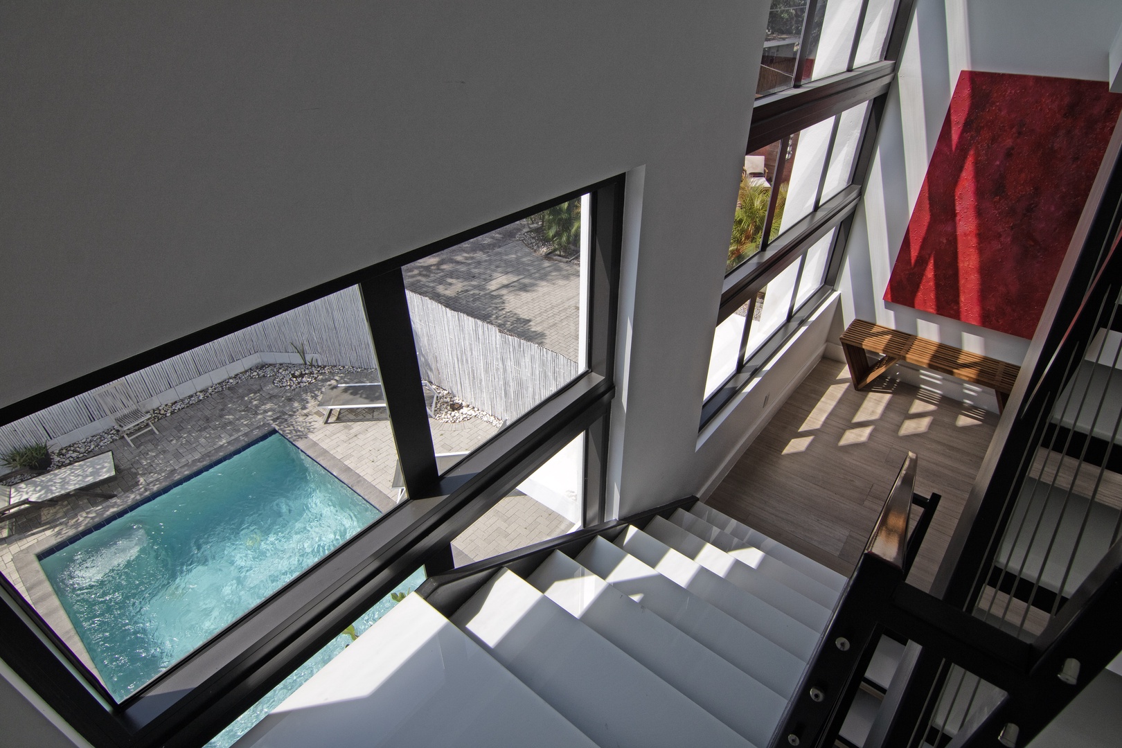 View of Private Pool from Interior Staircase