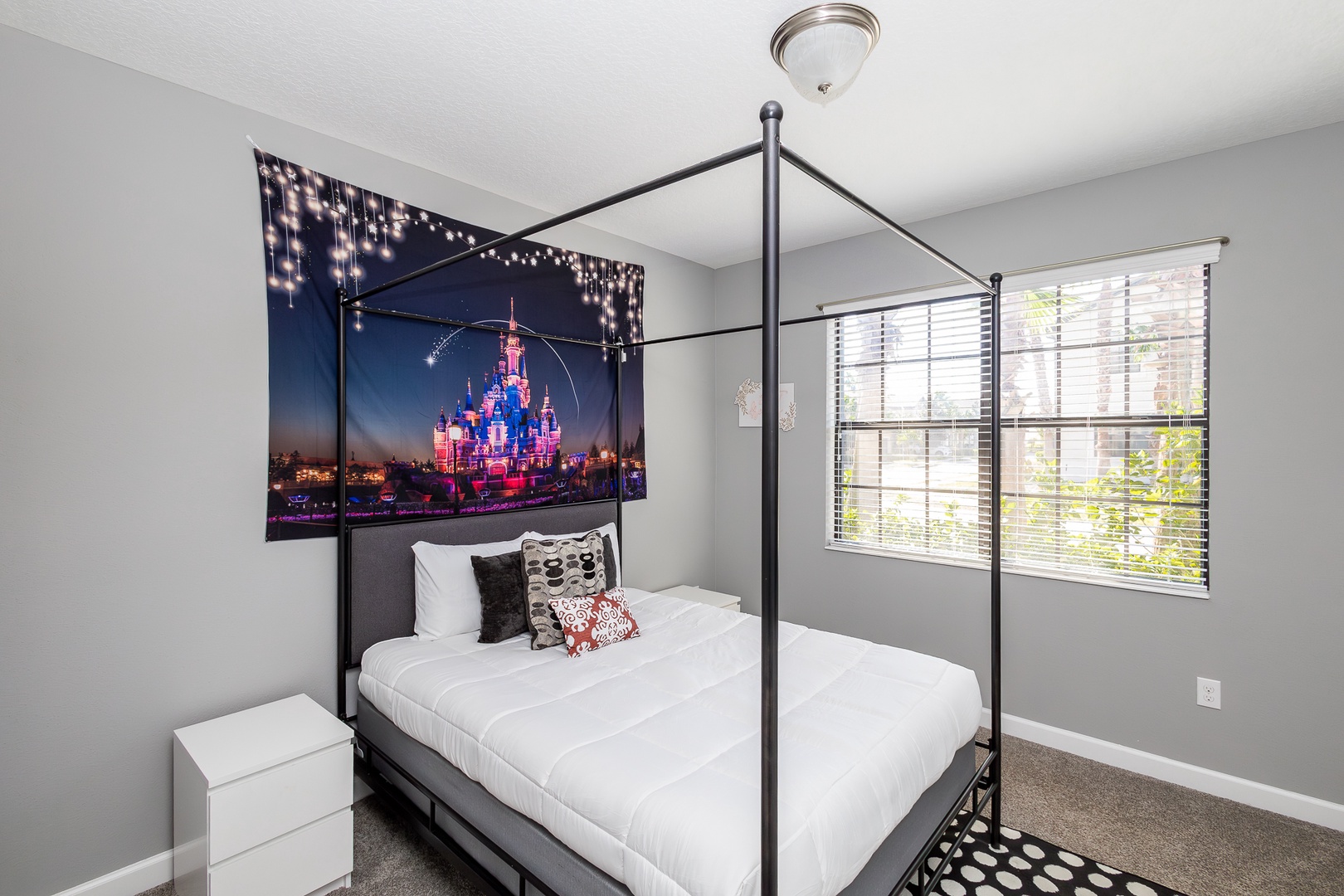 This bedroom retreat features a comfortable queen-size bed & smart TV